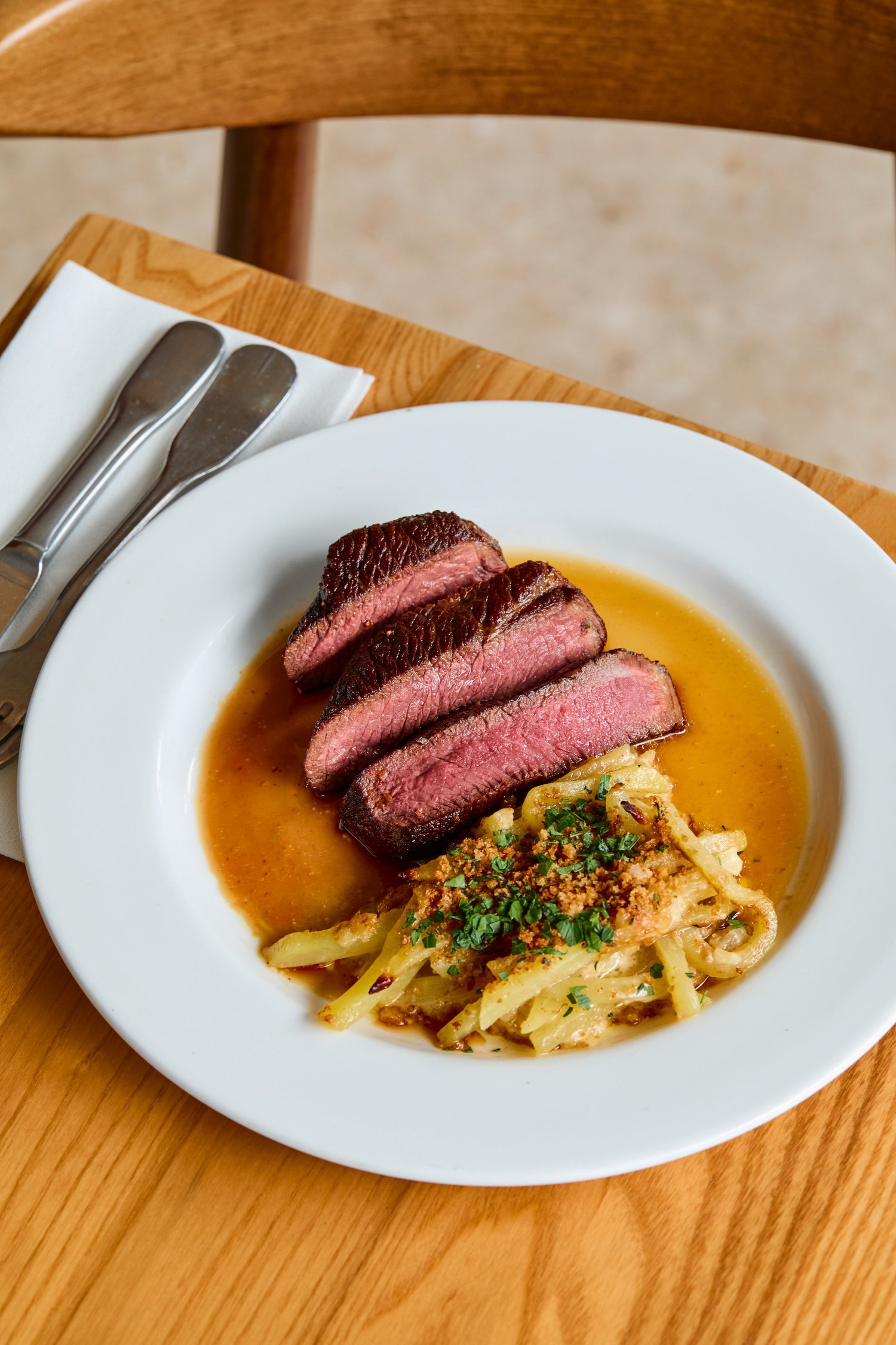 Sliced bavette steak with sauce