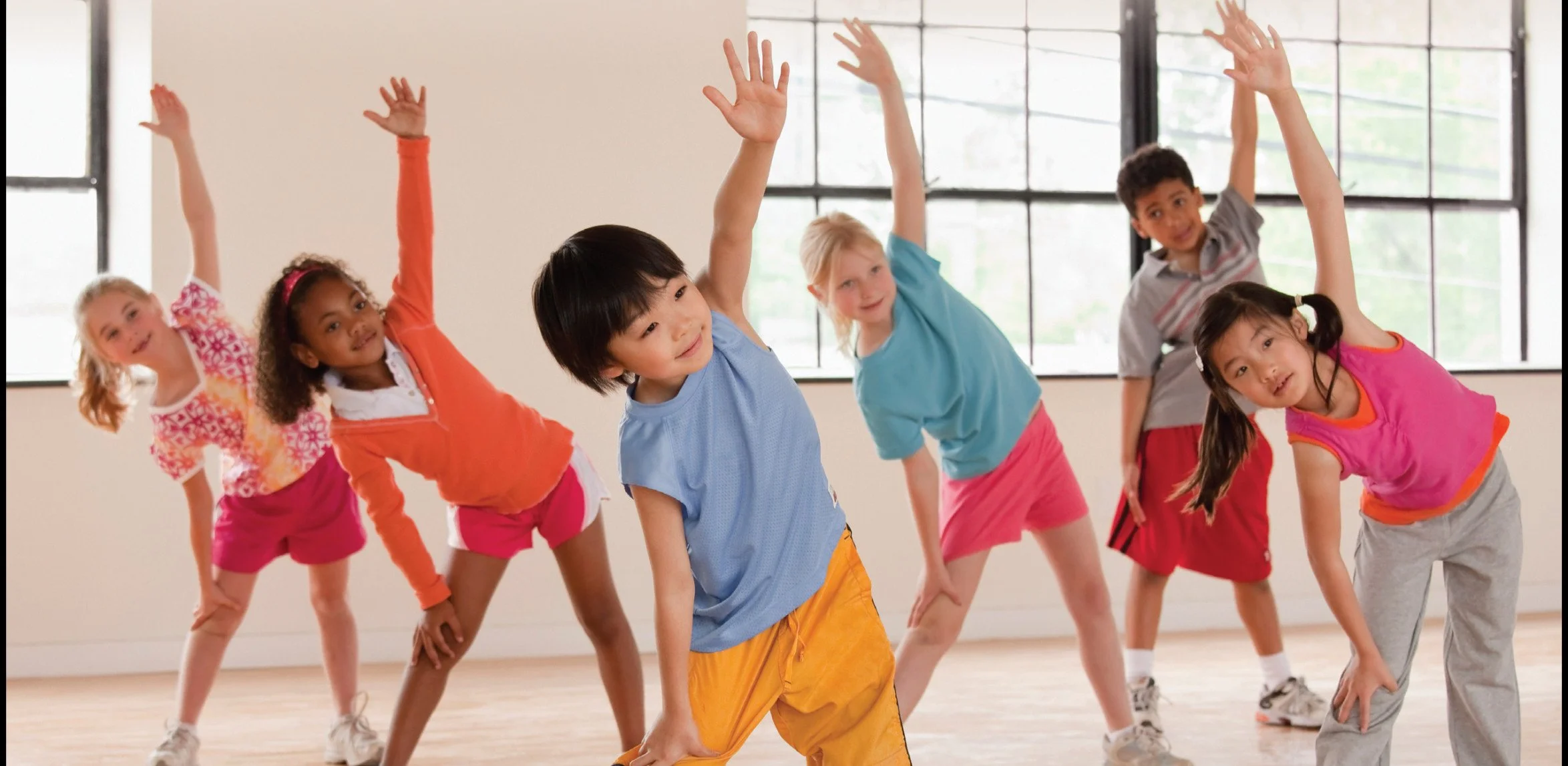 Children doing movement exercises in a classroom