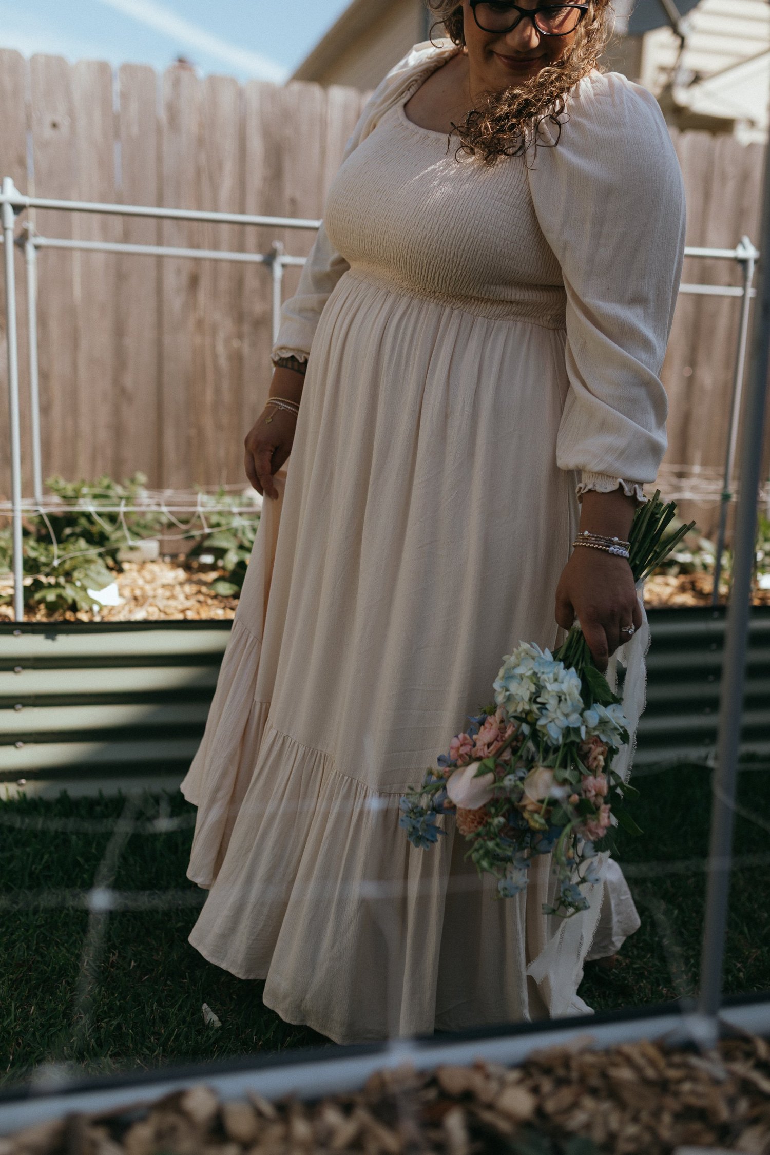 Jordyn among flowers at Motherhood in Blooms