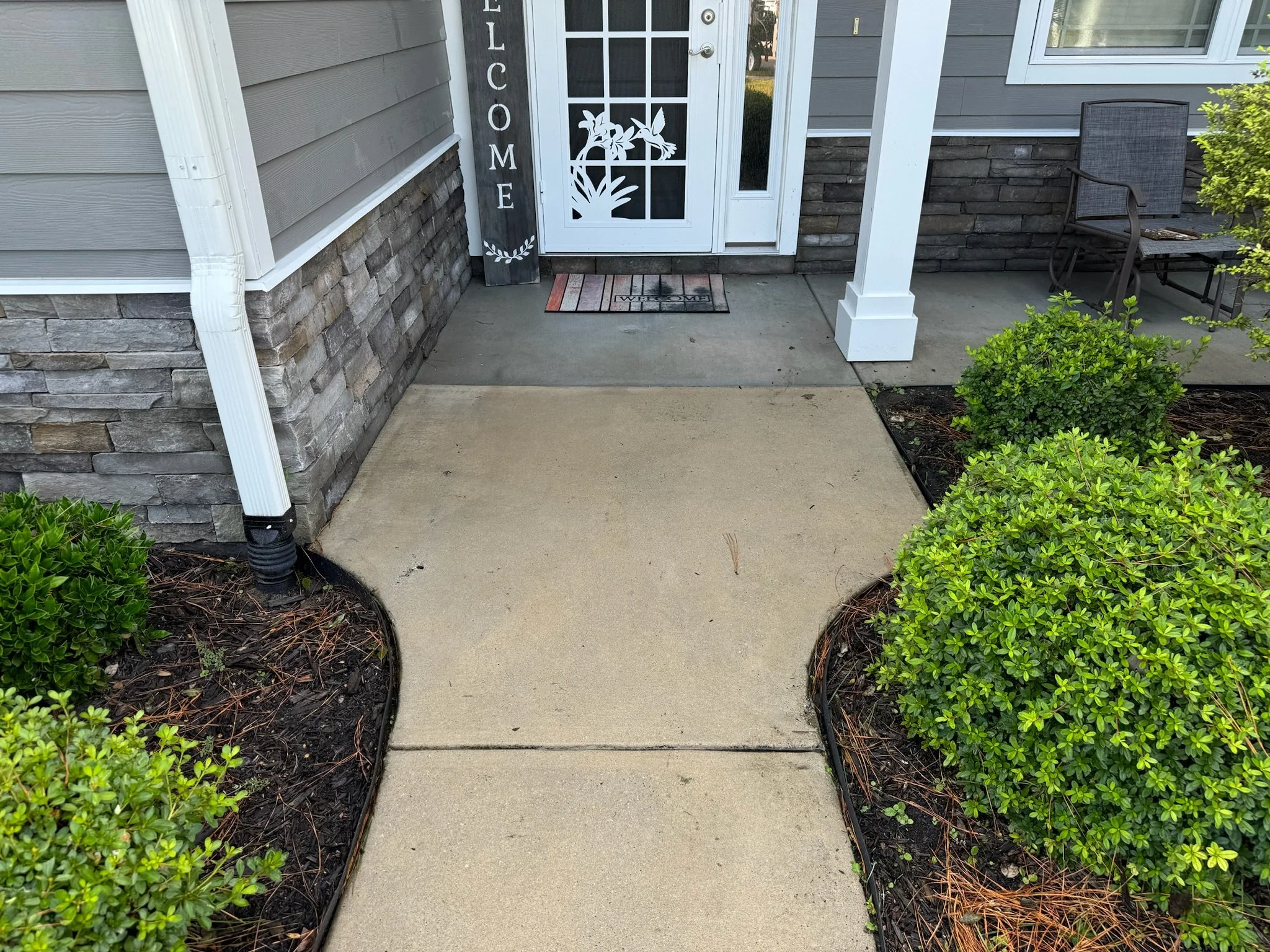 Clean front walkway after Kraken Harbor power washing