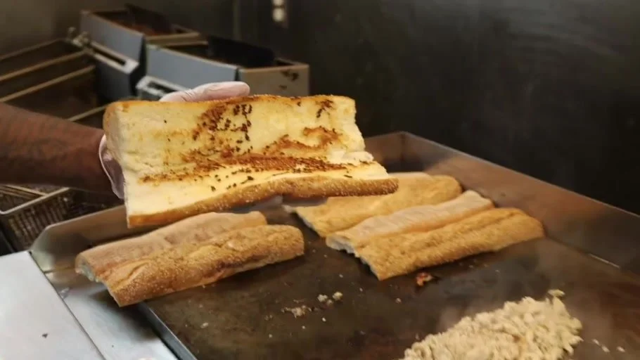 Sandwich rolls toasting on the Major Phillie flat top