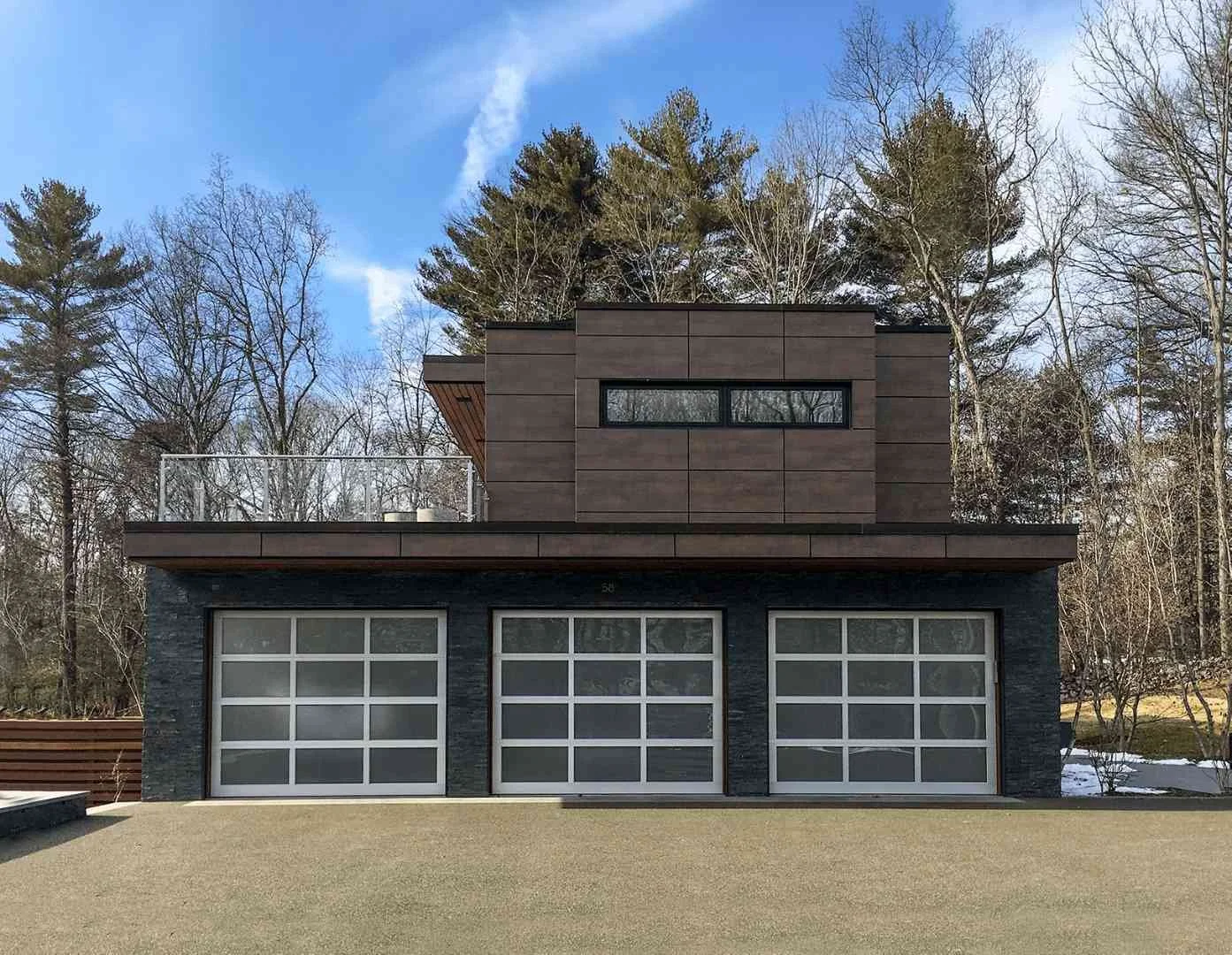 Commercial full-view aluminum garage door with glass panels in Chicago, IL.