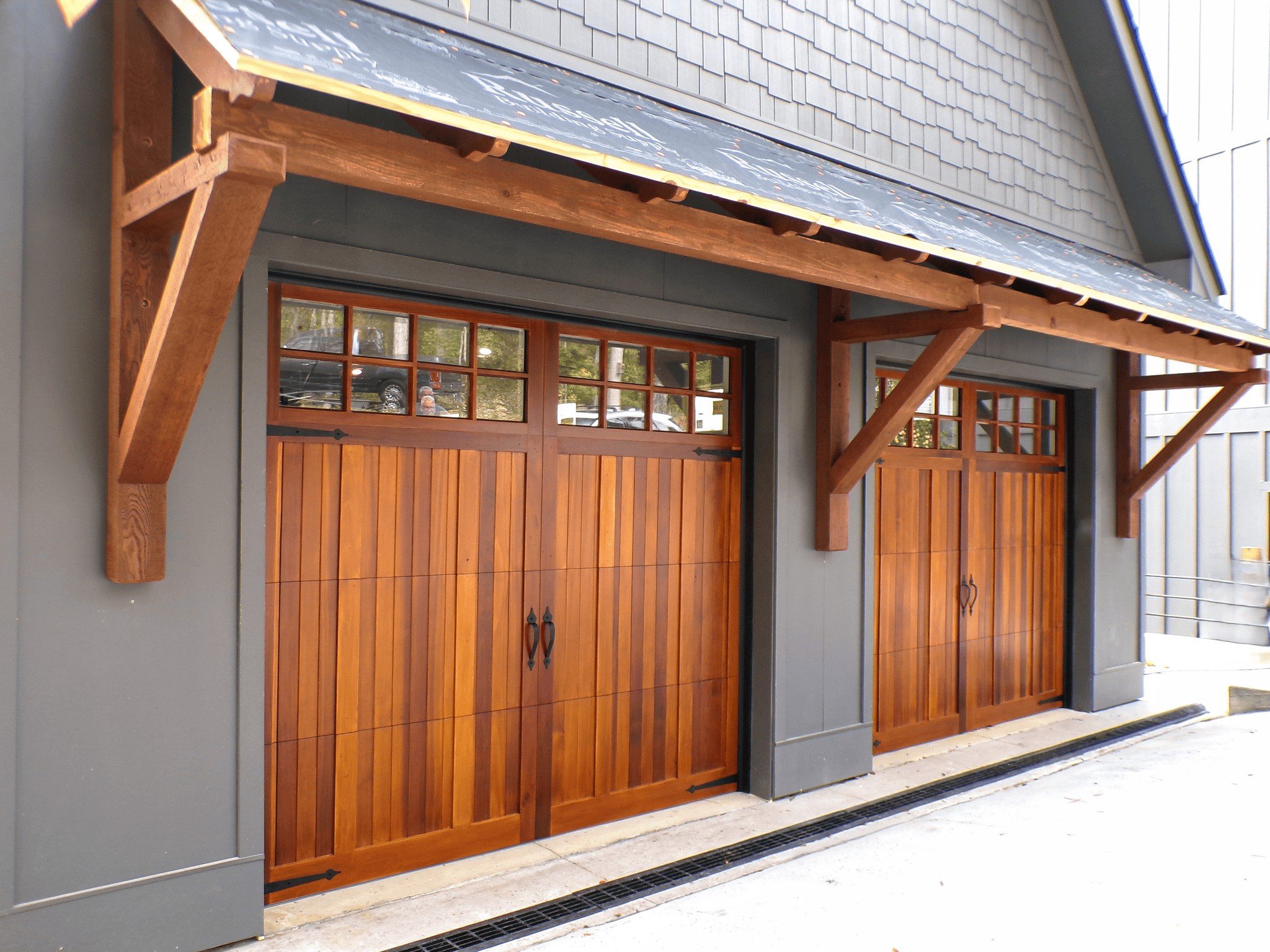 Overlay carriage house garage door with traditional design in Chicago, IL.