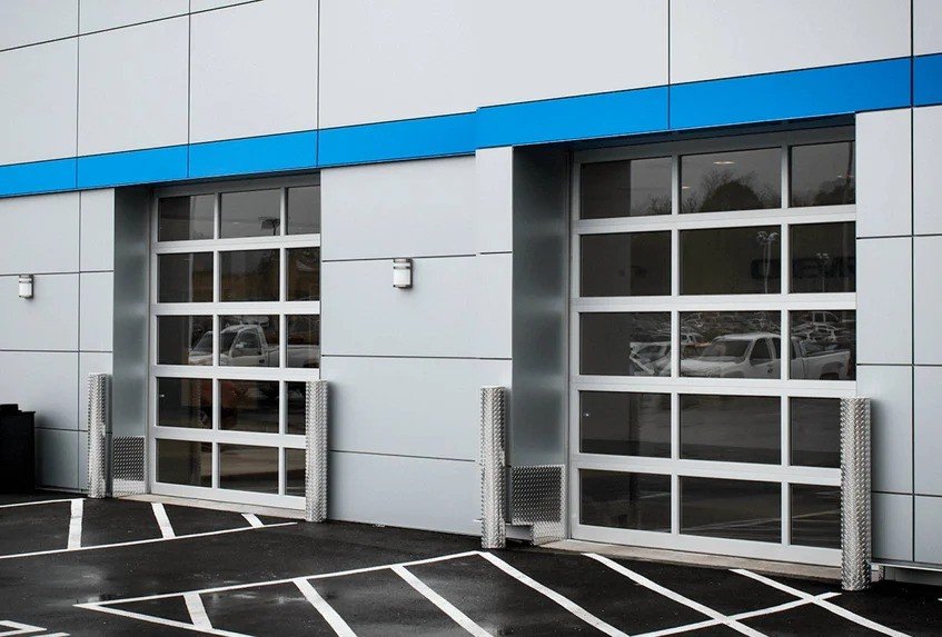 Commercial full-view aluminum garage door with glass panels in Chicago, IL.