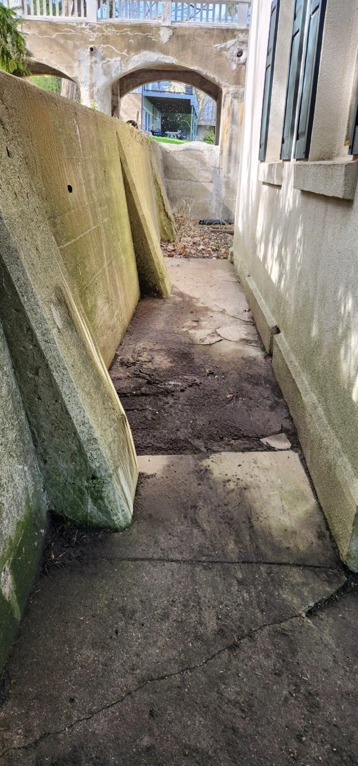 After GGL cleanup: the main walkway in the same side passage exposed after accumulated leaves and loose branches were removed