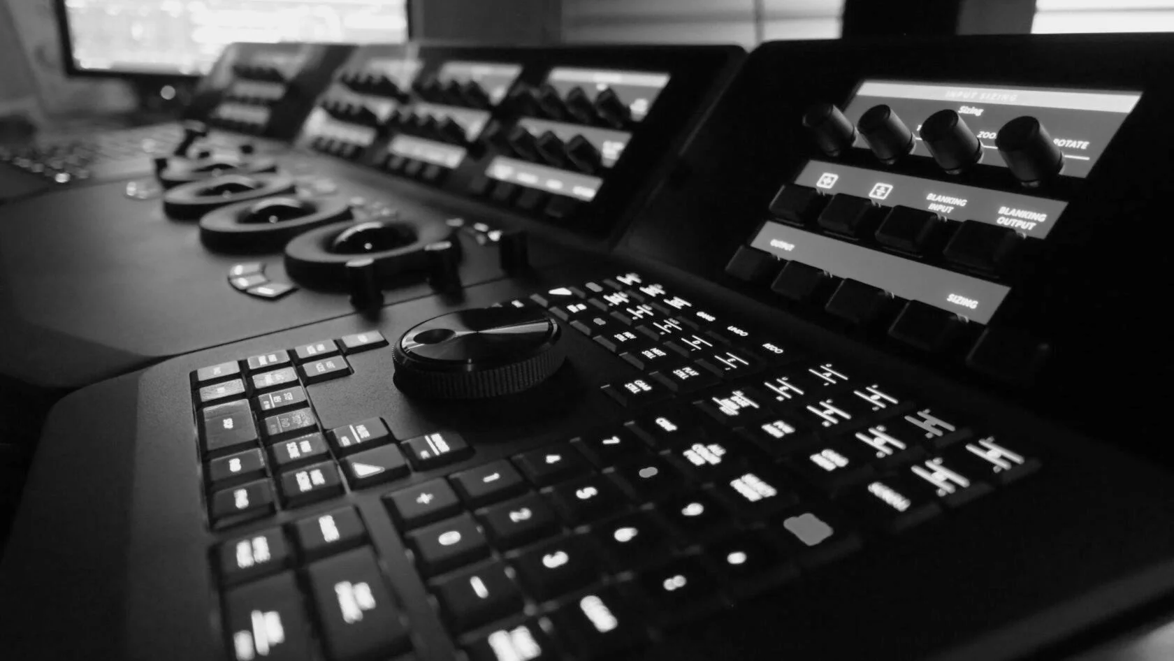 Black and white view of the DaVinci Resolve keyboard and color grading control surface