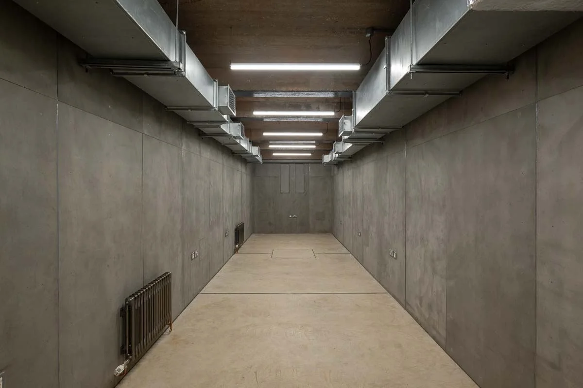 Tank Studio, a long stripped back room with strip lighting