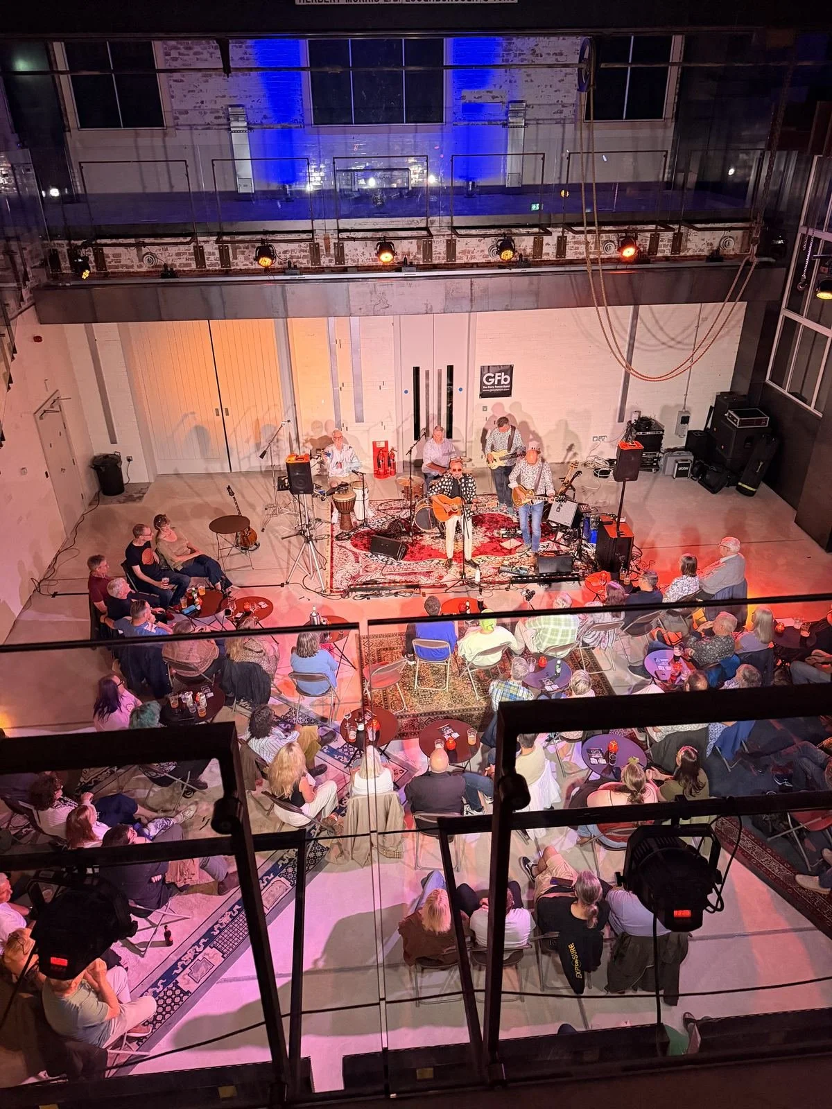 A band playing in the Main Hall, seen from the balcony