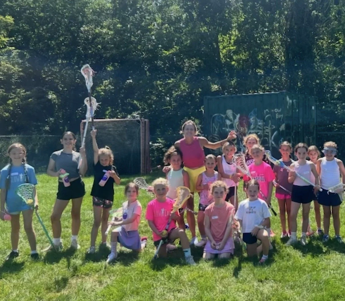 GLOW players and coaches together on the field.