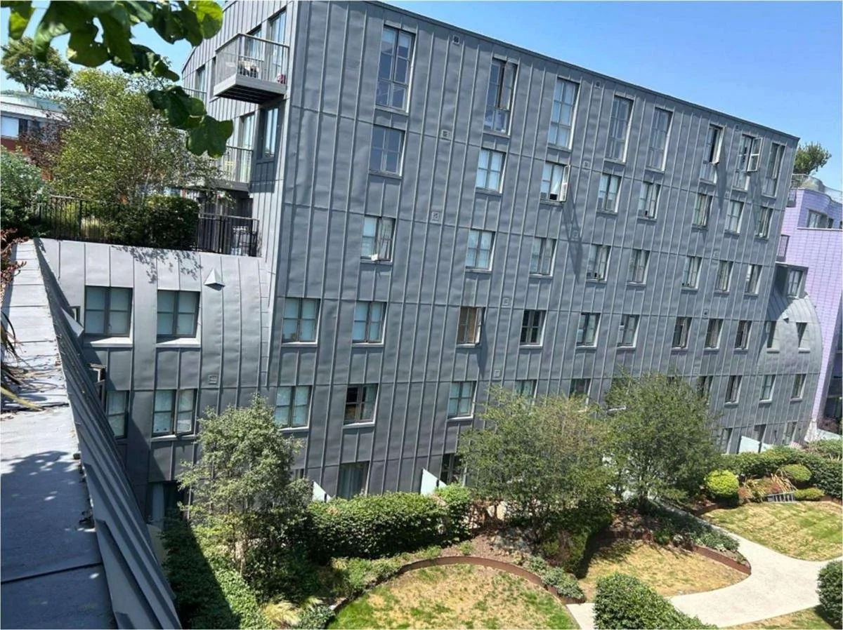 Zinc standing seam elevations of Islington Square Block B above the garden courtyard