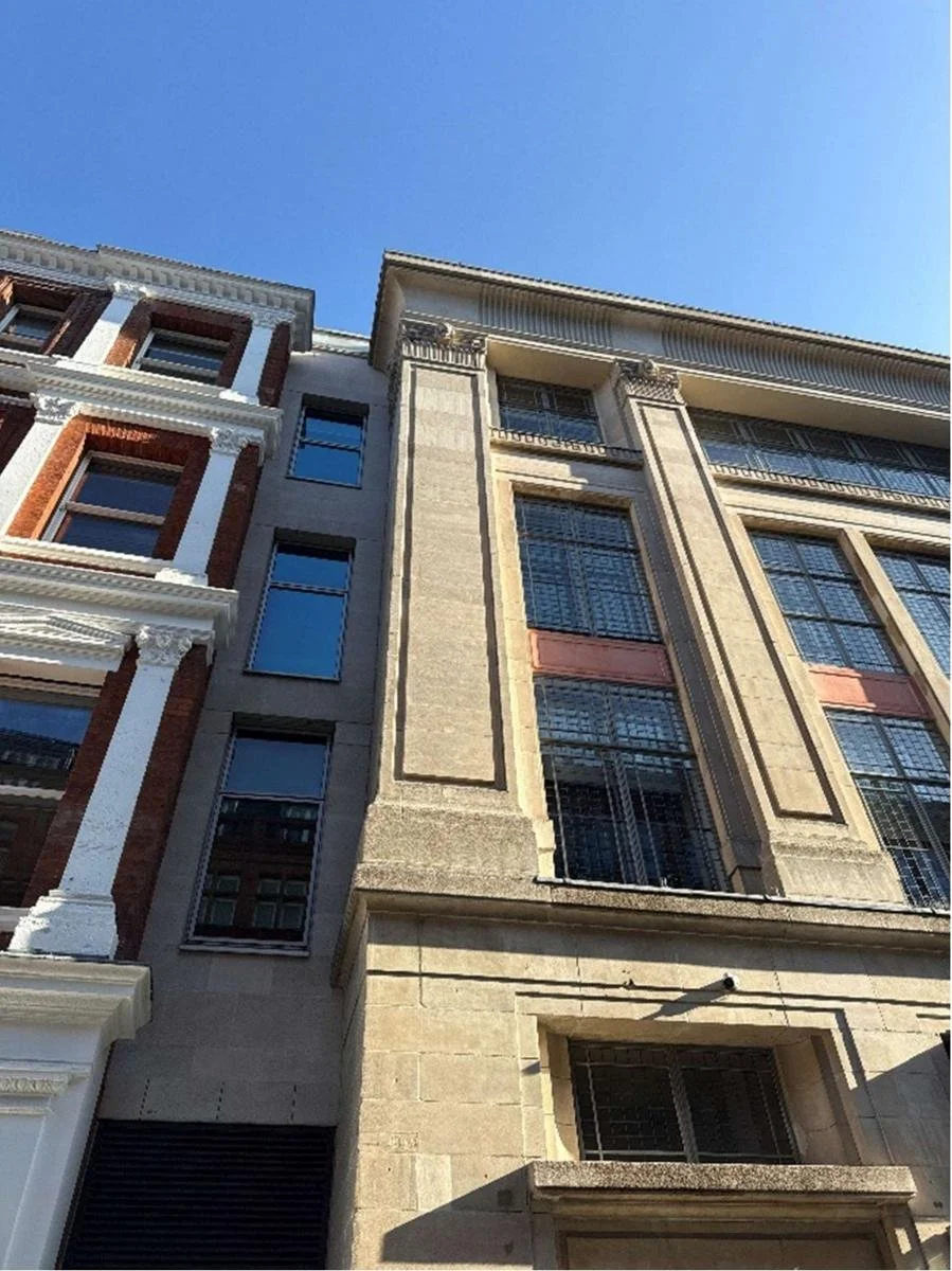 Cast-stone elevation of The Northcliffe with tall metal-framed windows