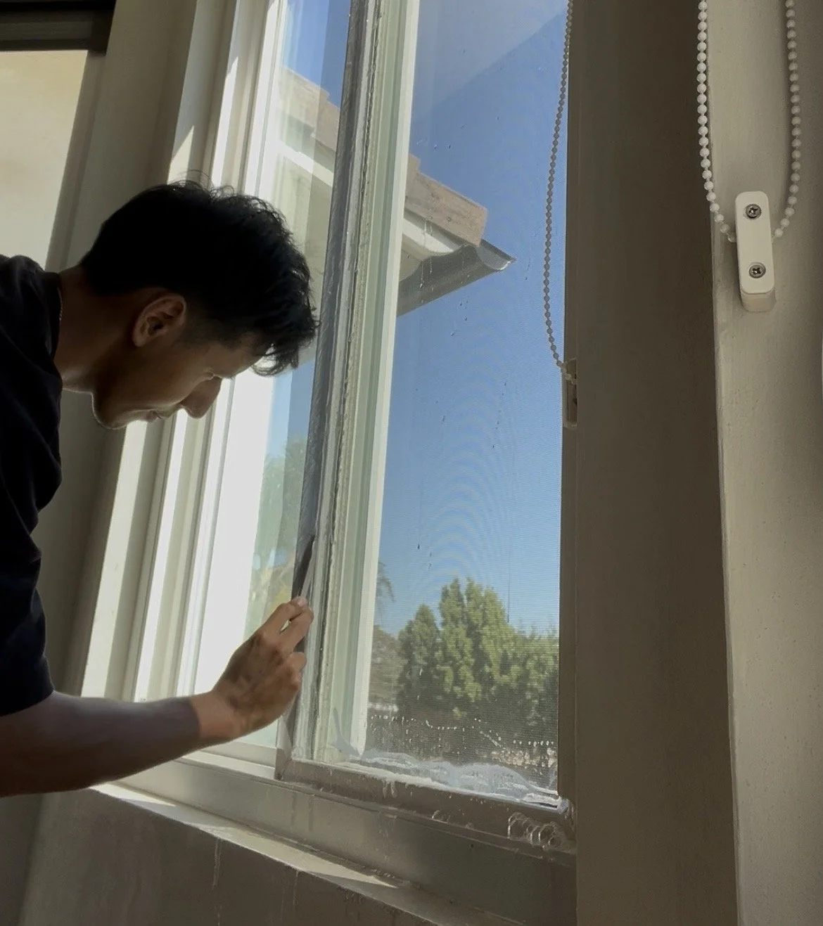 Installing solar control window film on a sliding glass door in Orange County