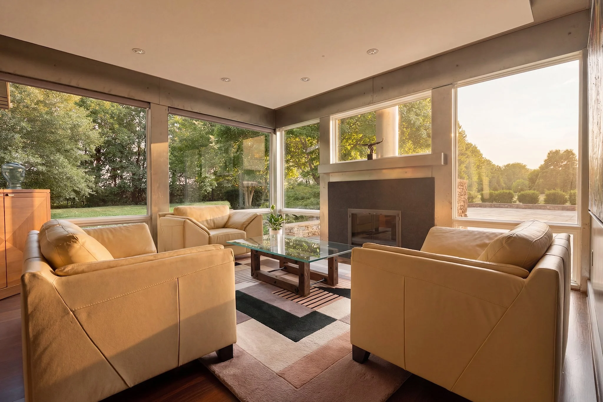 The same living room in the Bull City Media Signature style — warm, editorial tones with soft golden light