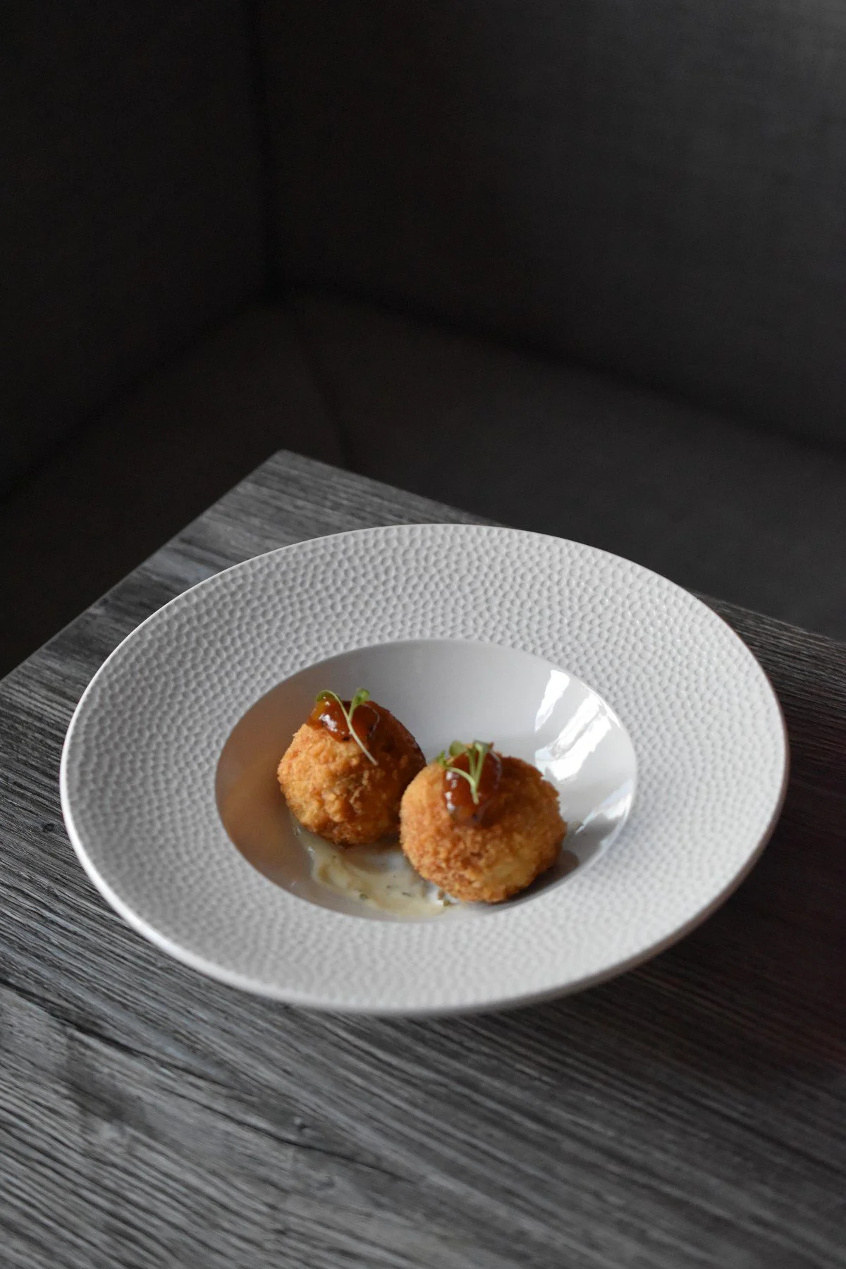 Chicken Biryani Arancini on a white plate