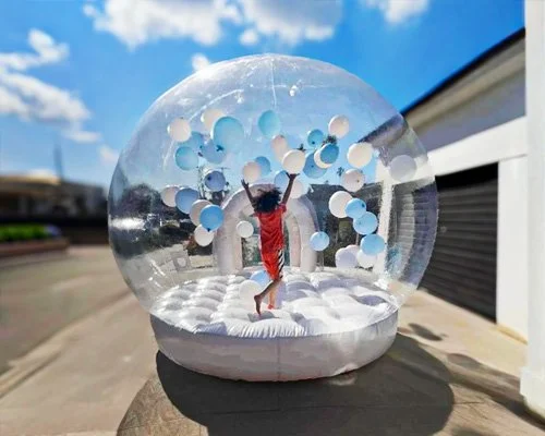 Clear inflatable balloon dome with entrance tunnel — magical party rental for toddlers and kids