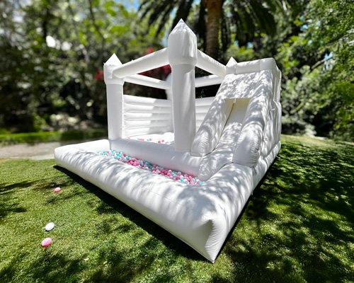 Triple Delight 15x15 bounce house with slide and pastel ball pit — perfect for kids' parties ages 3–12