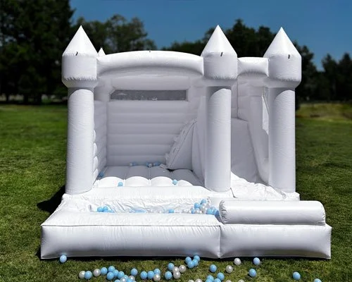Cozy Castle — small white bounce house with slide, ball pit, tall soft walls, and sun cover for parties ages 3–12