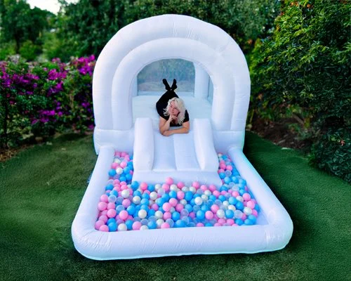 Tiny Play bounce house with pastel ball pit and mini slide — perfect for toddlers 1–3 years old