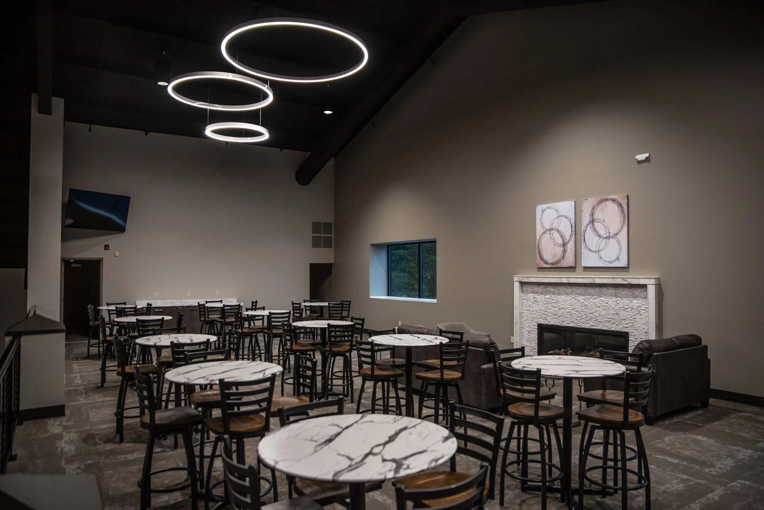 Tower Event and Conference Center Mezzanine with high-top tables and fireplace lounge