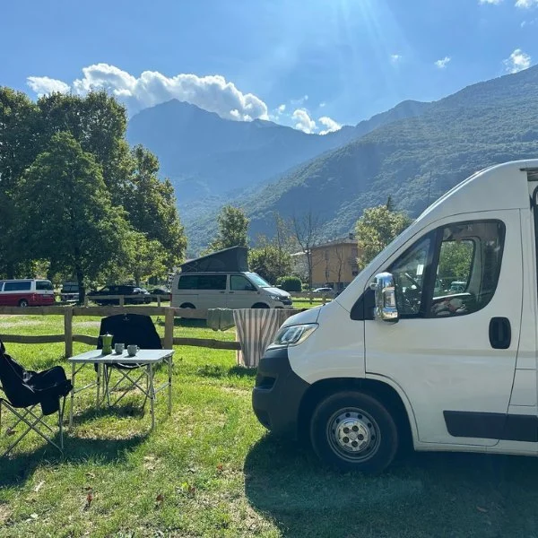 Campervan in a sunny mountain campsite