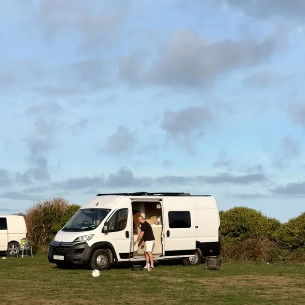 Campervan pitched up on a grassy site