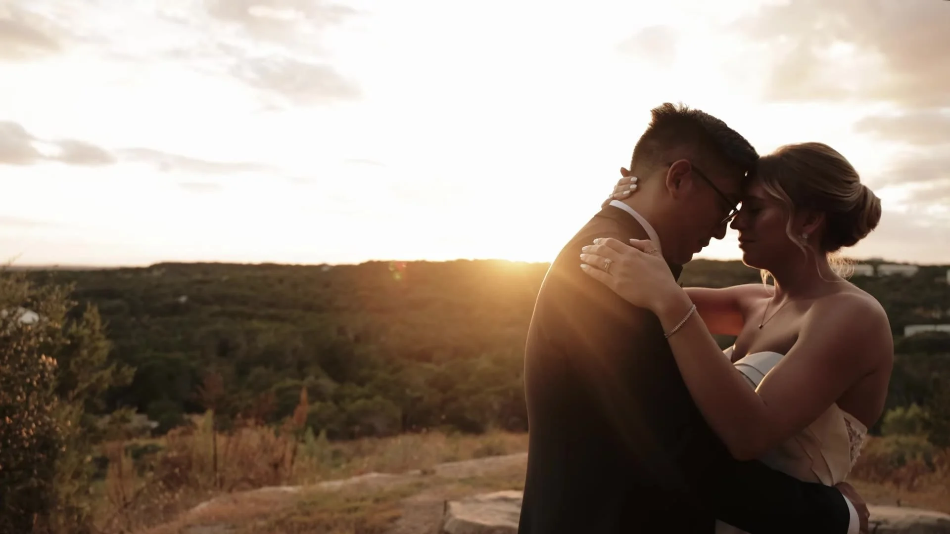 Jason and Rachel forehead to forehead at golden hour overlooking Austin Hill Country at Canyonwood Ridge in Dripping Springs, Texas
