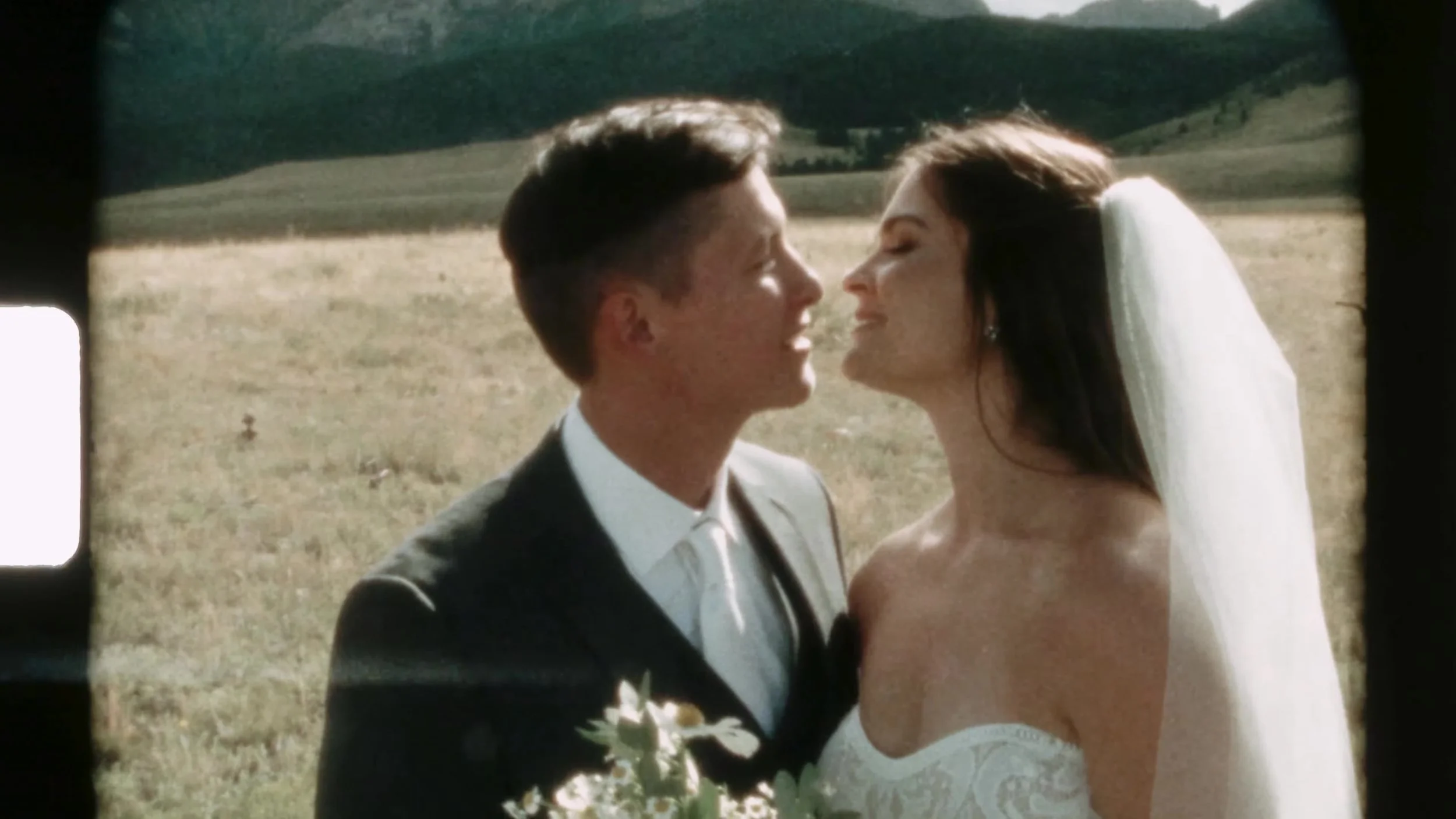 Super 8 tight shot of Seth and Cass smiling forehead to forehead at 3 Peaks Ranch in Colorado