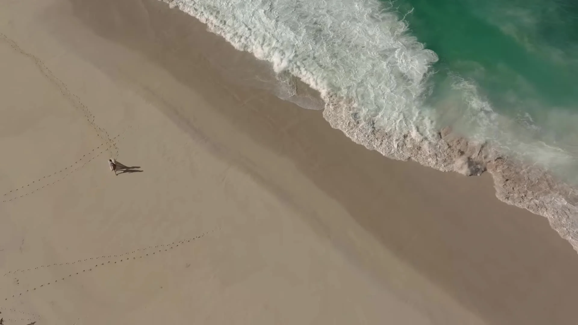 Aerial of sandy Dominican Republic beach and turquoise water near Amanera