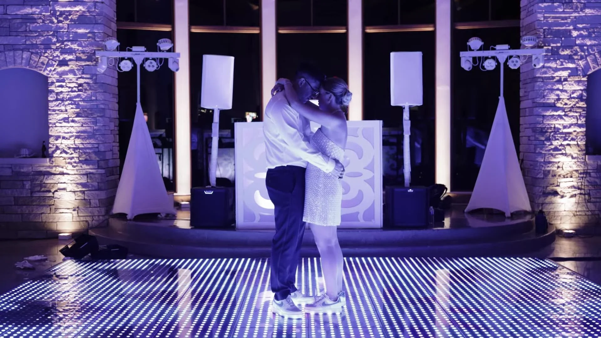 Jason and Rachel first dance on a light up floor at Canyonwood Ridge in Dripping Springs, Texas