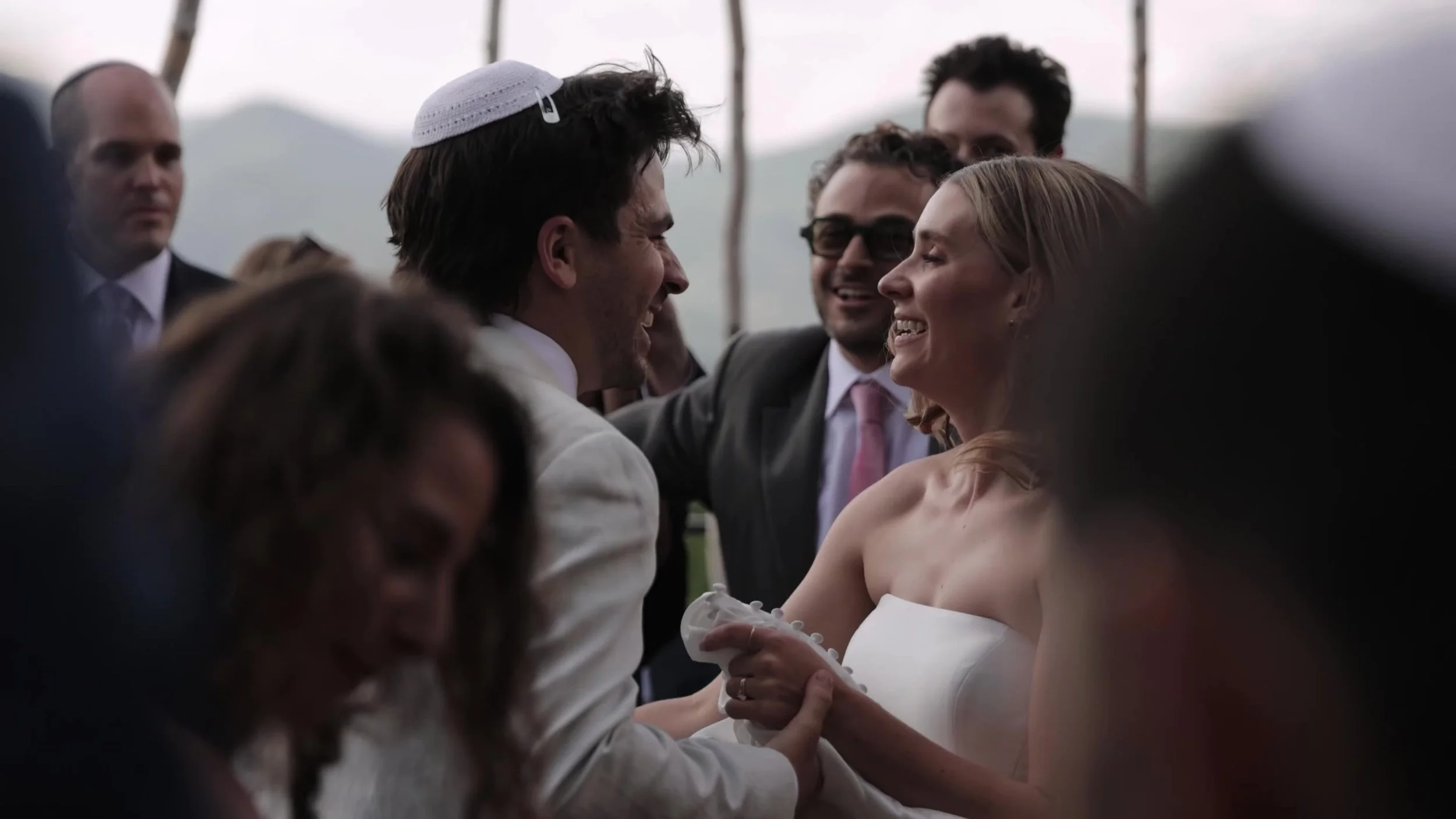 Bride and groom smiling and laughing together while dancing at Northstar Gatherings in Idaho Springs, Colorado
