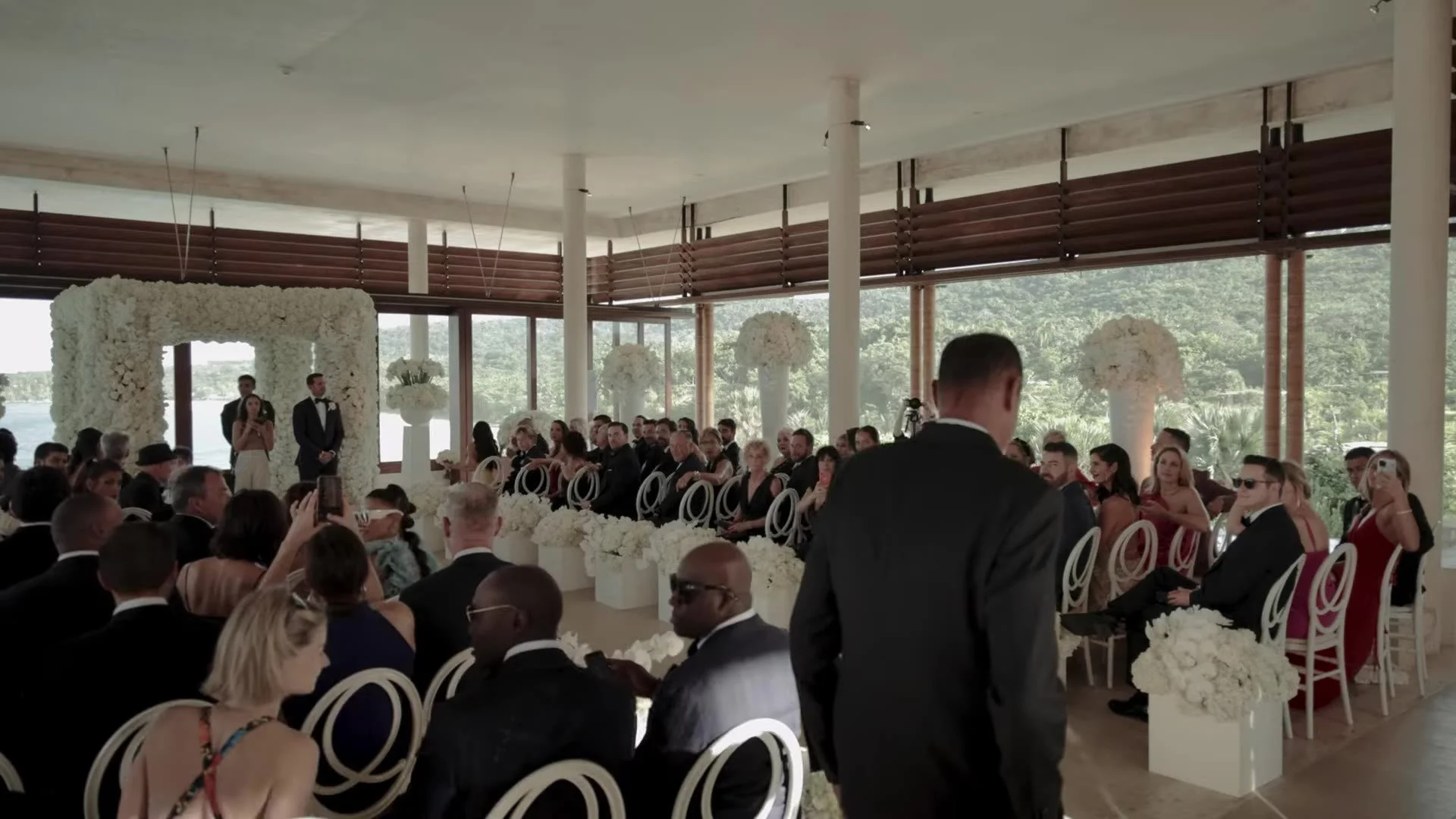 Ceremony aisle with white florals and ocean view at Amanera Dominican Republic