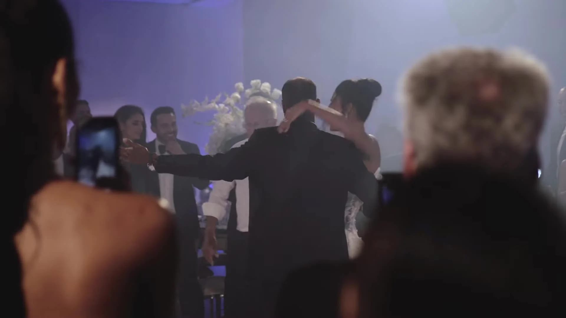Guests watching Daniela and Adam dance in purple light Amanera Dominican Republic