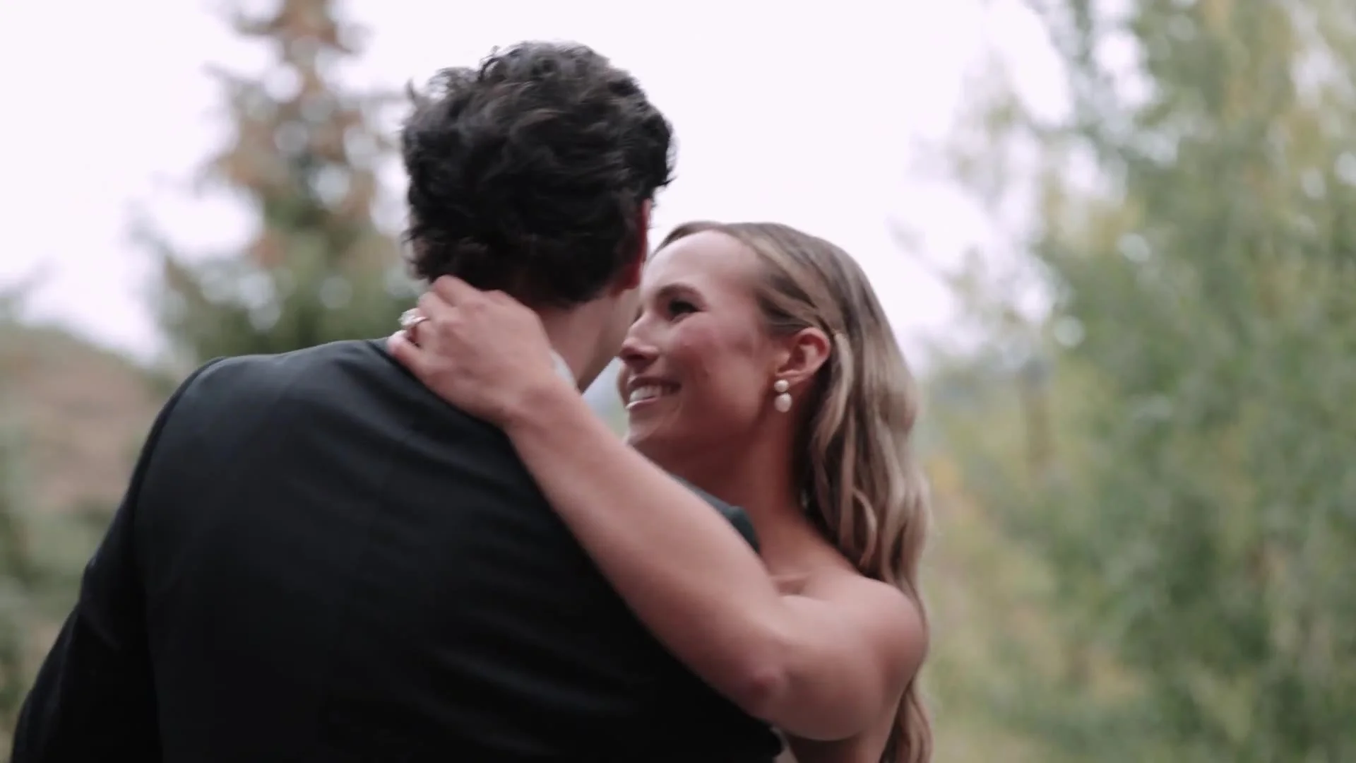 Tight embrace of Becca and Colton dancing at Crested Butte Wedding Garden in Colorado