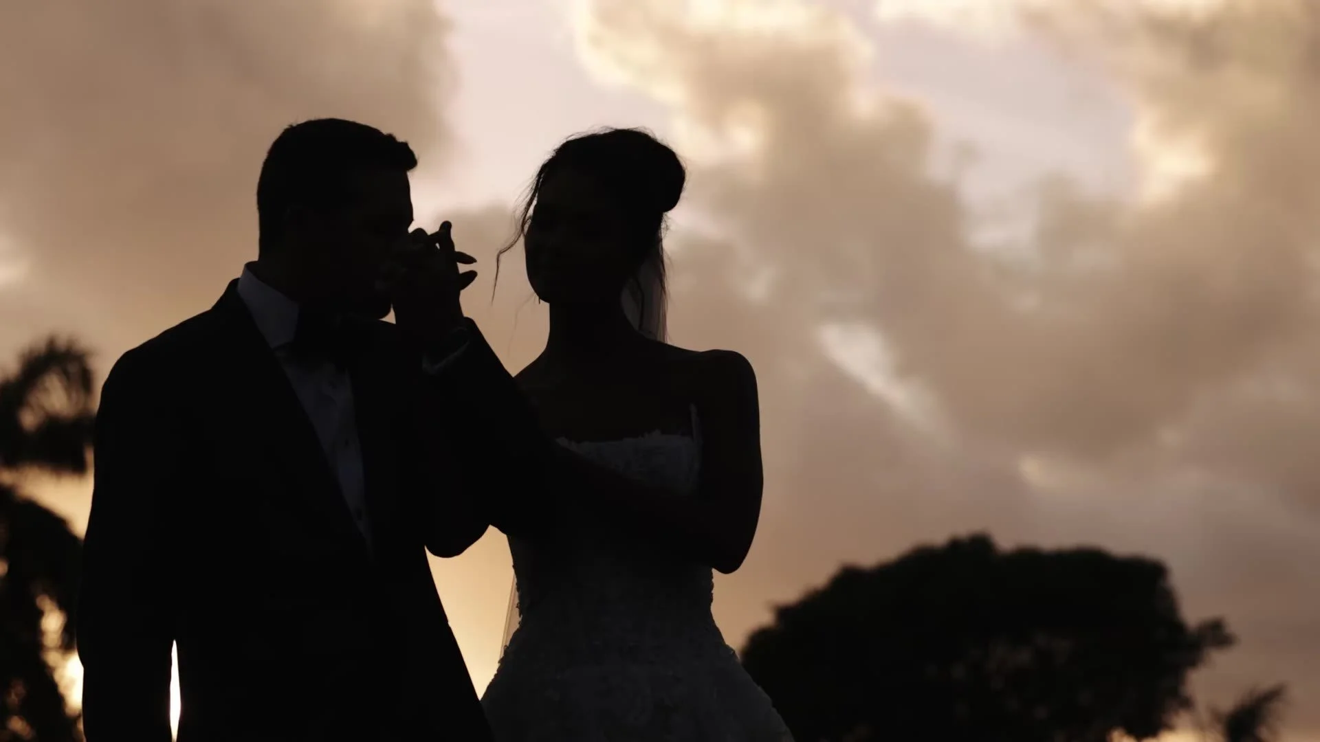 Silhouette of Daniela and Adam against sunset at Amanera Dominican Republic