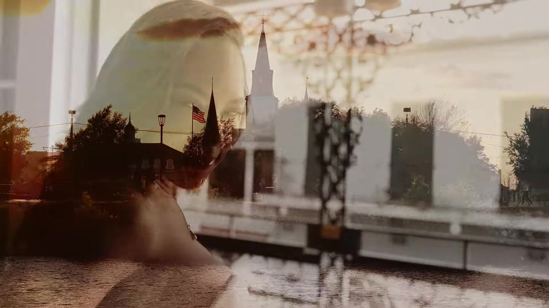 Double exposure of Blair with St. Louis Cathedral and French Quarter rooftops at golden hour in New Orleans