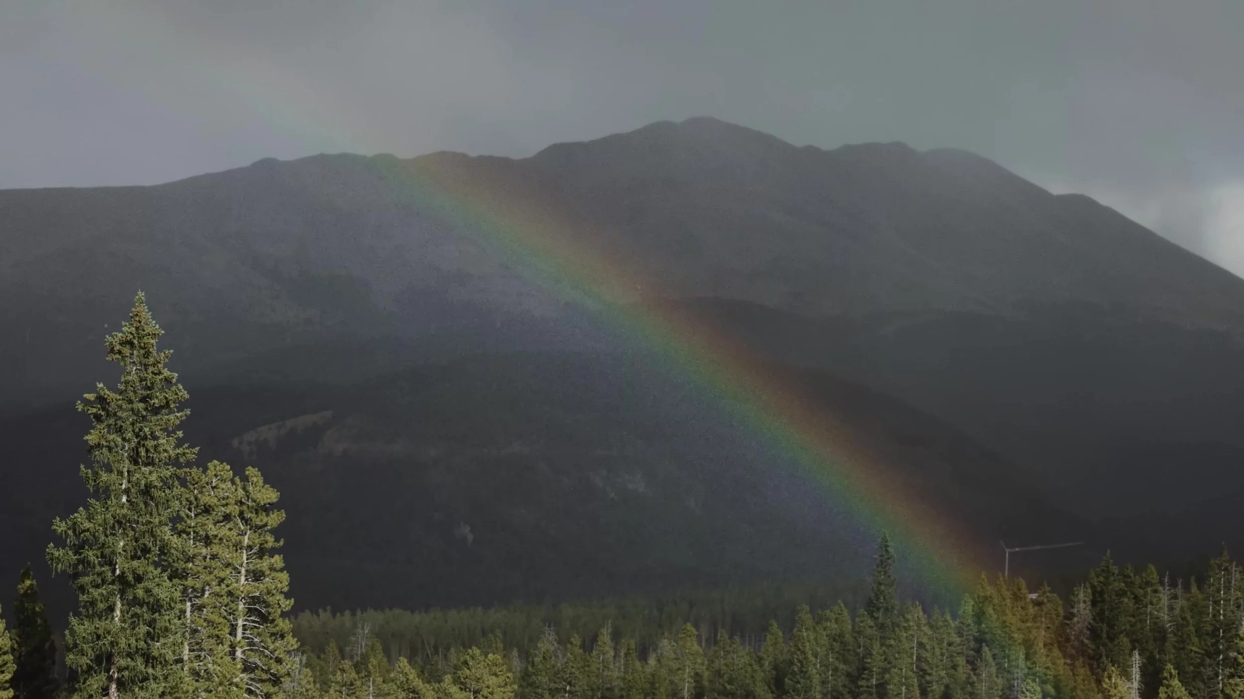 Rainbow after a hailstorm over the mountains at a Ten Mile Station wedding in Breckenridge, Colorado