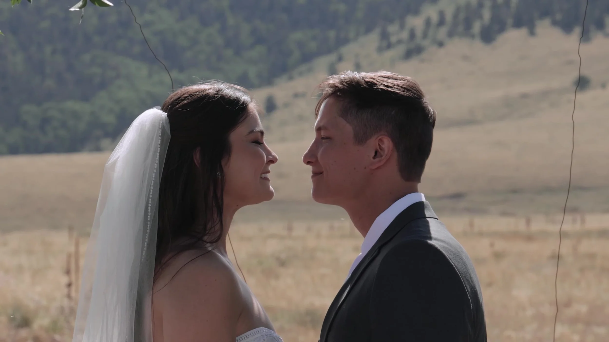 Tight profile of Seth and Cass looking at each other at 3 Peaks Ranch in Westcliffe, Colorado