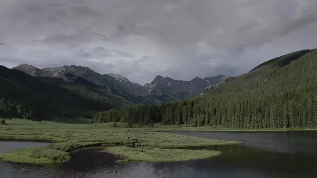 Piney Lake and the Gore Range under a heavy sky at Piney River Ranch