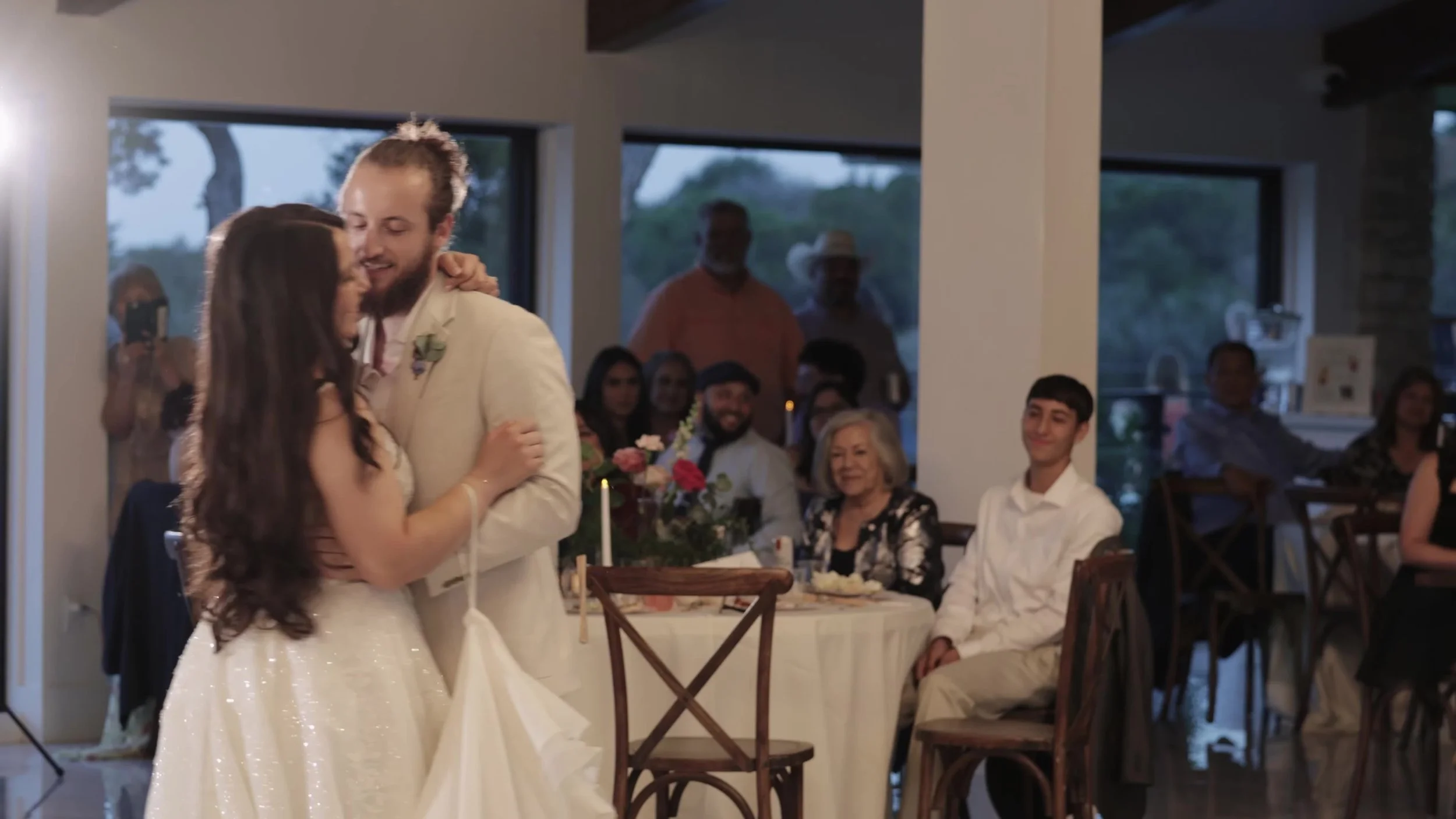 Peter and Kiyara smiling during their first dance at Videre Estate Austin Texas Hill Country