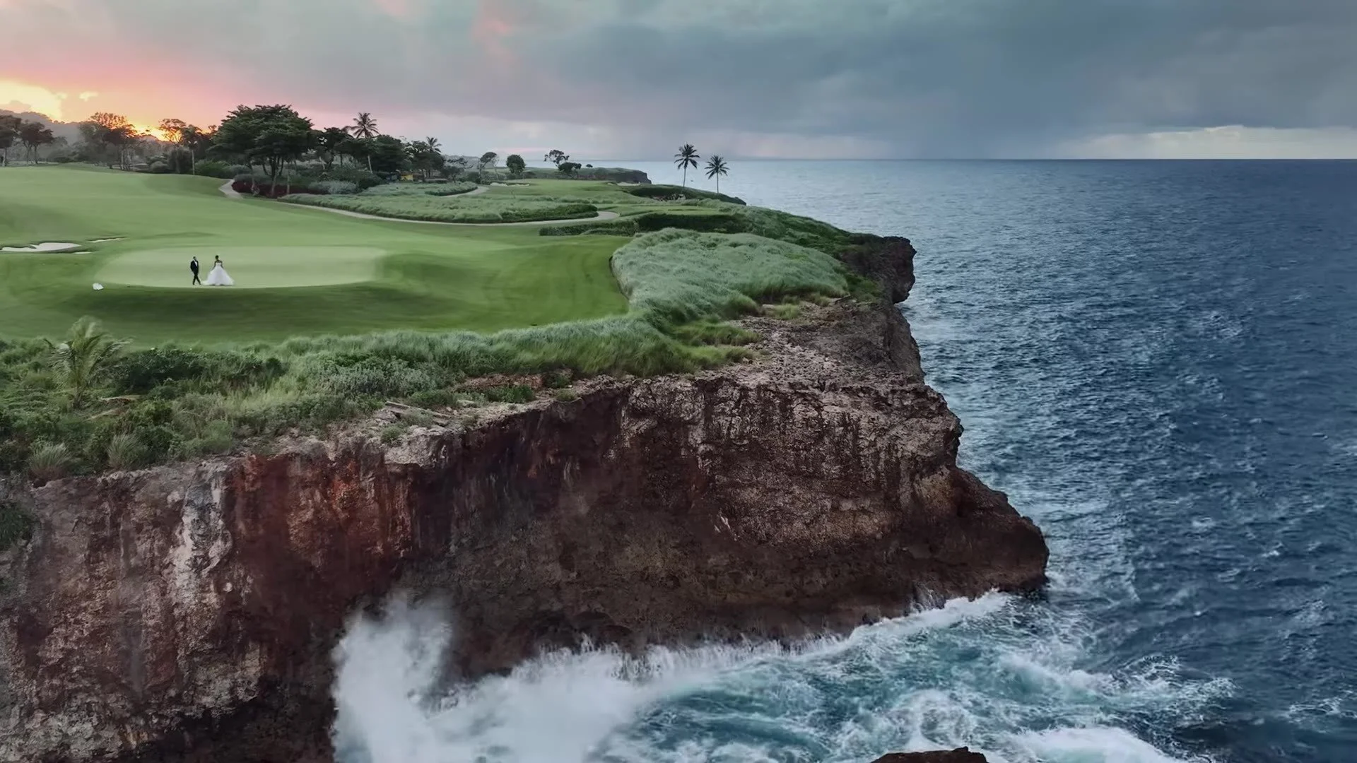 Golden hour cliffs and turquoise Dominican Republic coast below Amanera