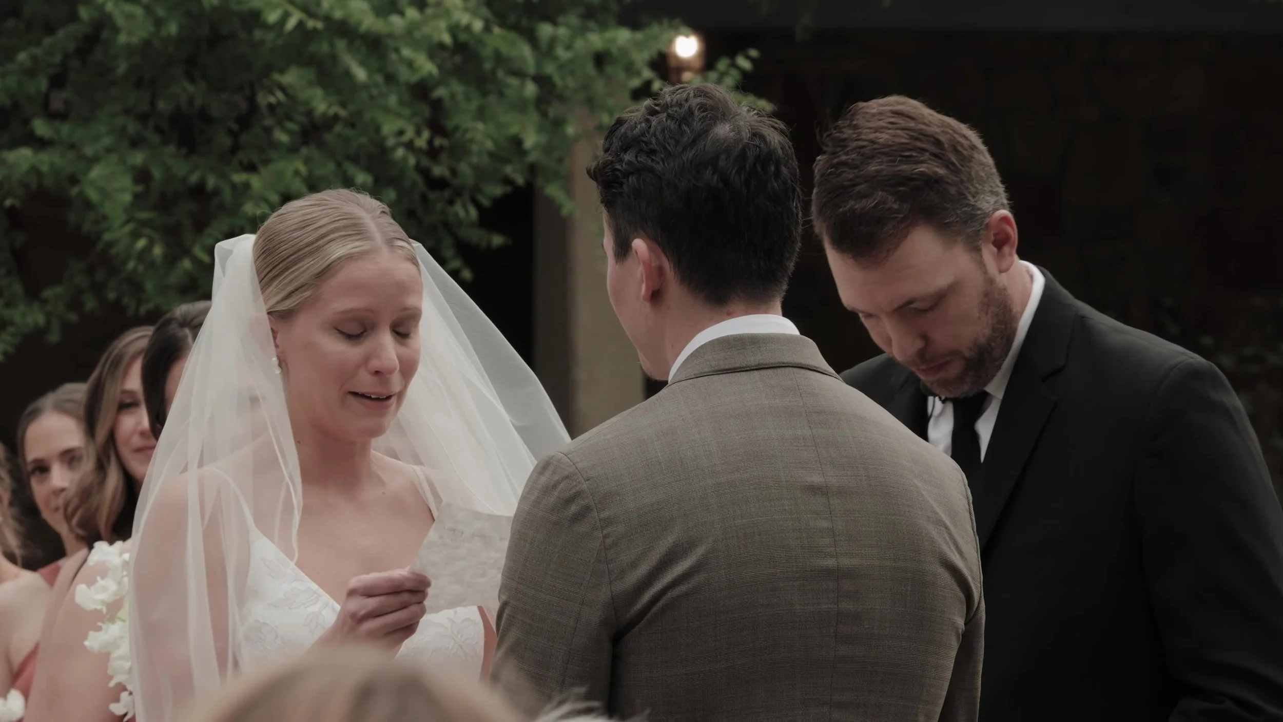 Heather reading vows to Chris during the outdoor ceremony at Lady Bird Johnson Wildflower Center in Austin, Texas