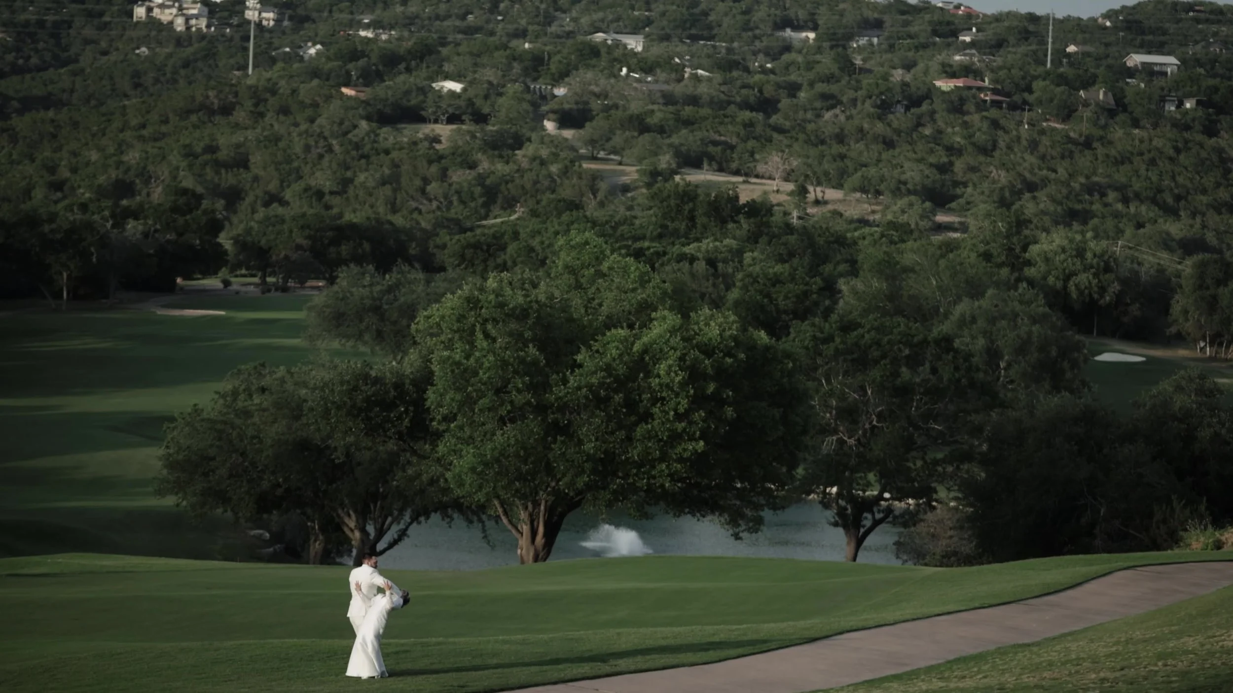 Wide green fairway and Texas Hill Country trees at Barton Creek Country Club near Austin