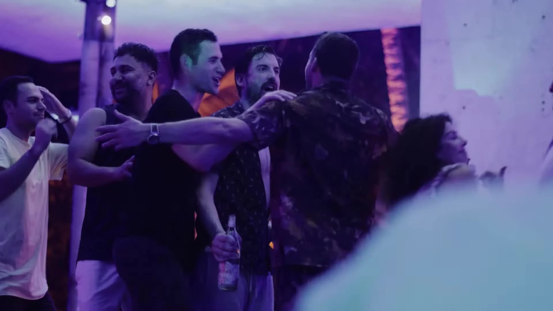 Adam and guests celebrating under purple lights at Amanera Dominican Republic