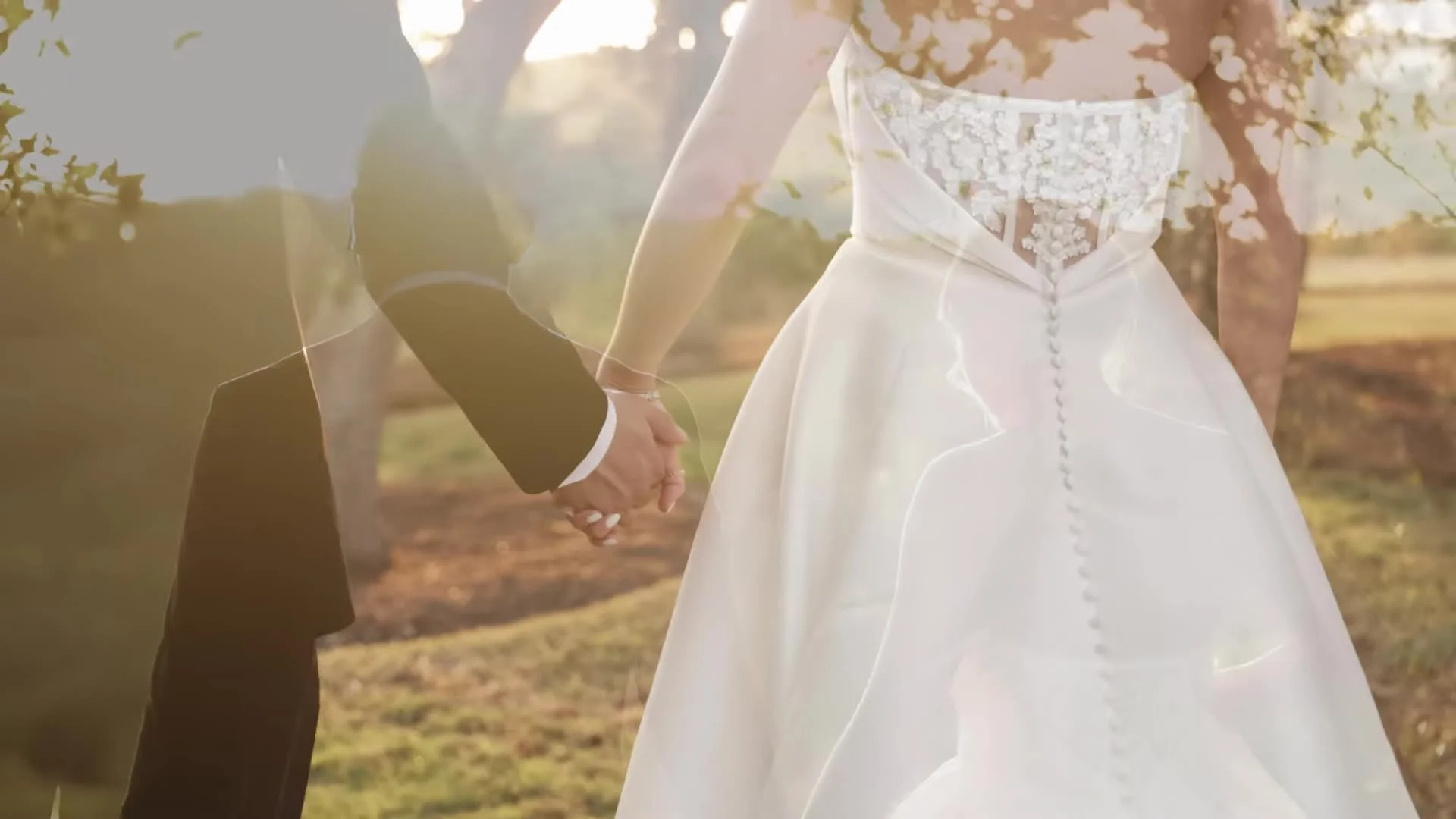 Jason and Rachel walking hand in hand into the sun at Canyonwood Ridge in Dripping Springs, Texas, lace buttons on her gown