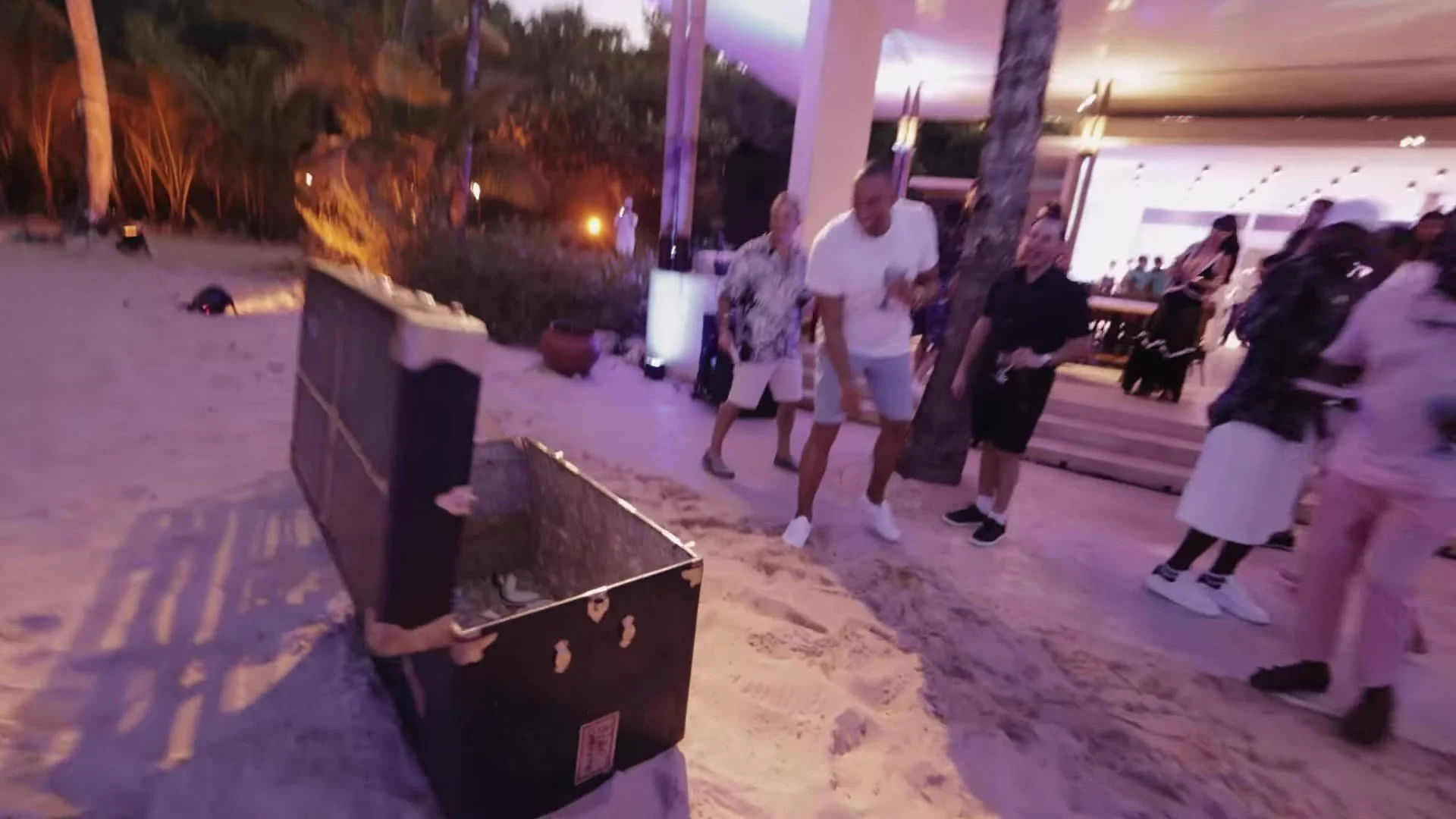 Beach bonfire and guests at night at Amanera Dominican Republic