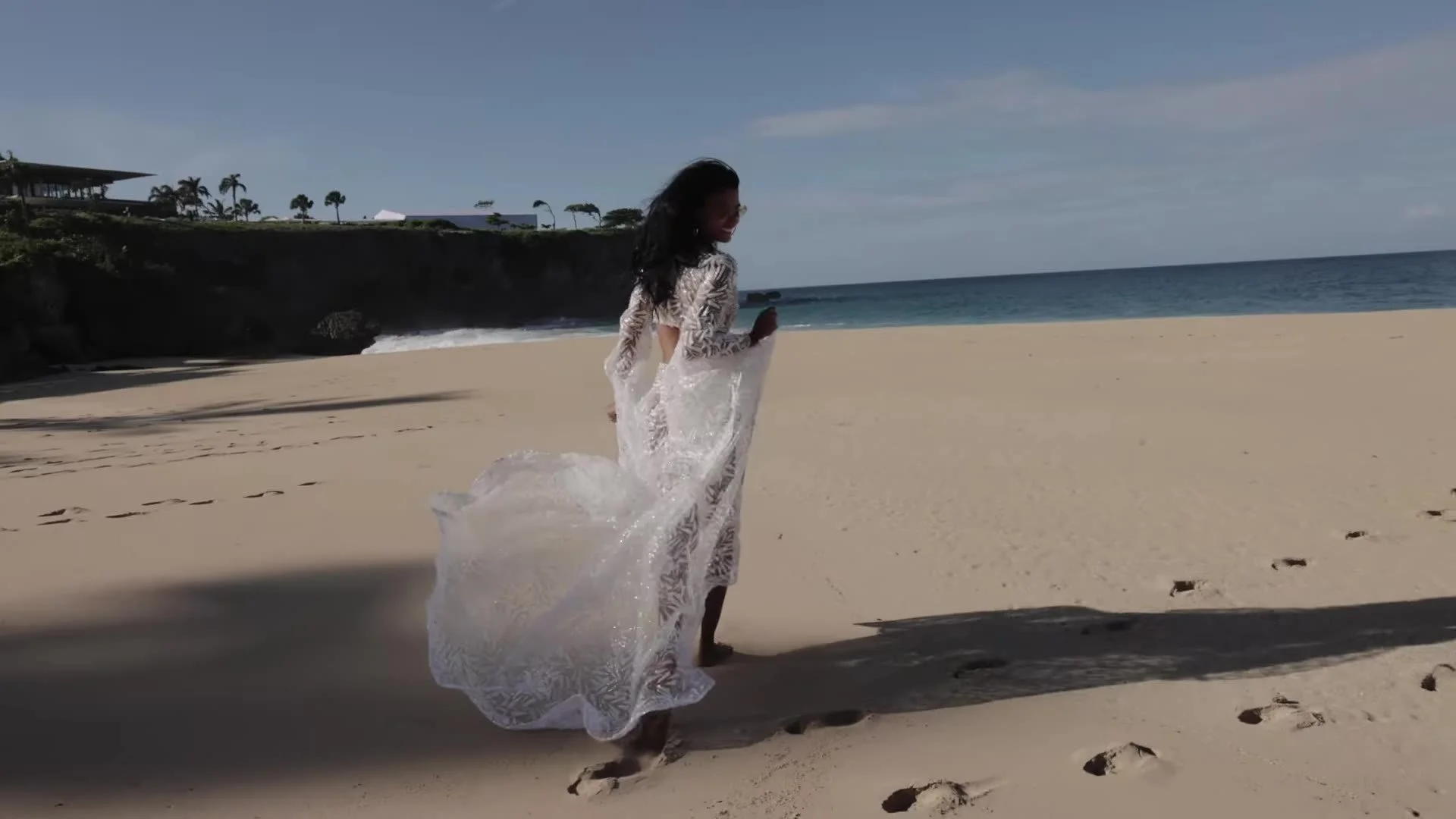 Daniela walking the beach in white lace train at Amanera Dominican Republic