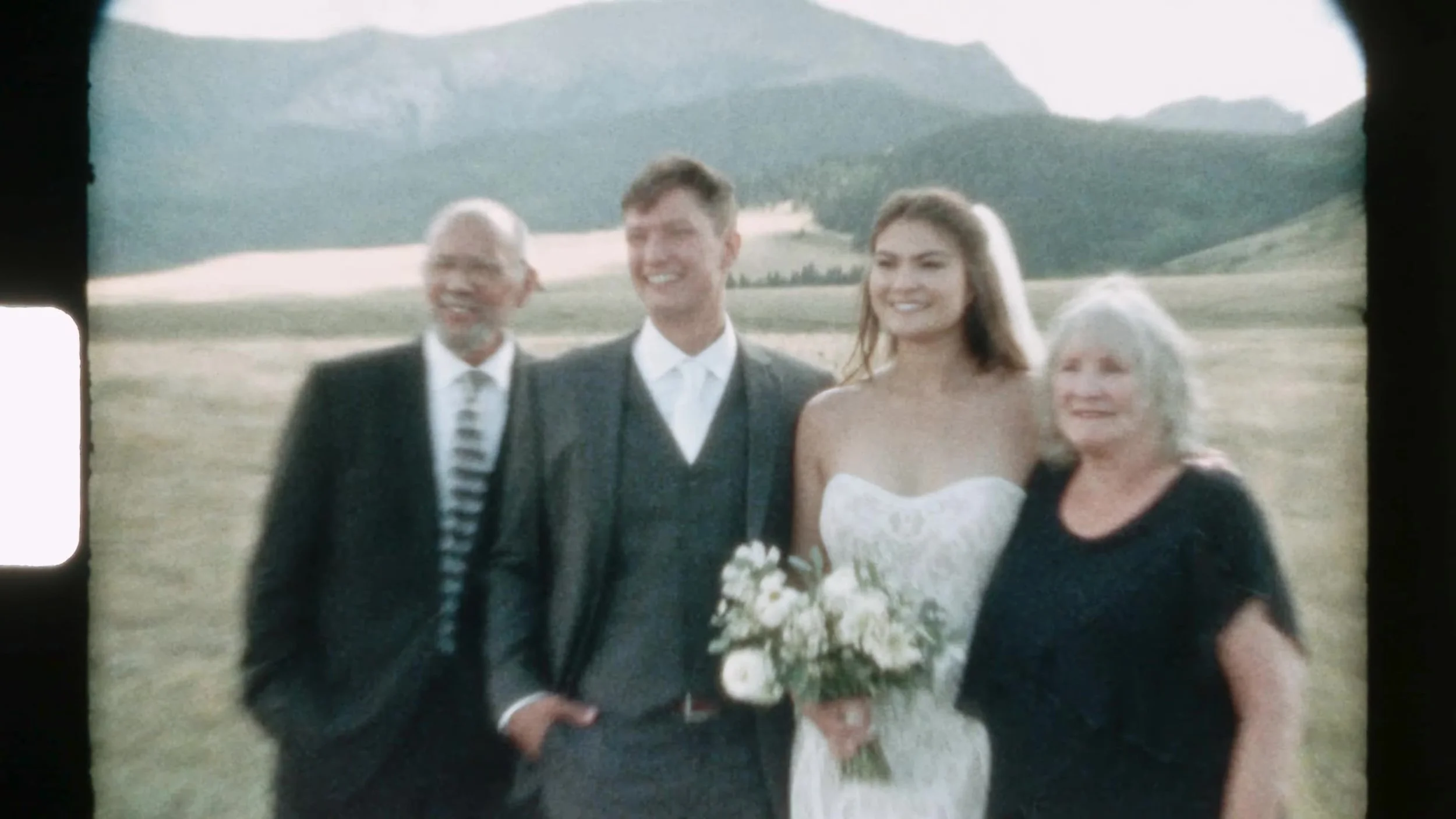 Super 8 portrait of Seth and Cass with family in a meadow at 3 Peaks Ranch in Colorado