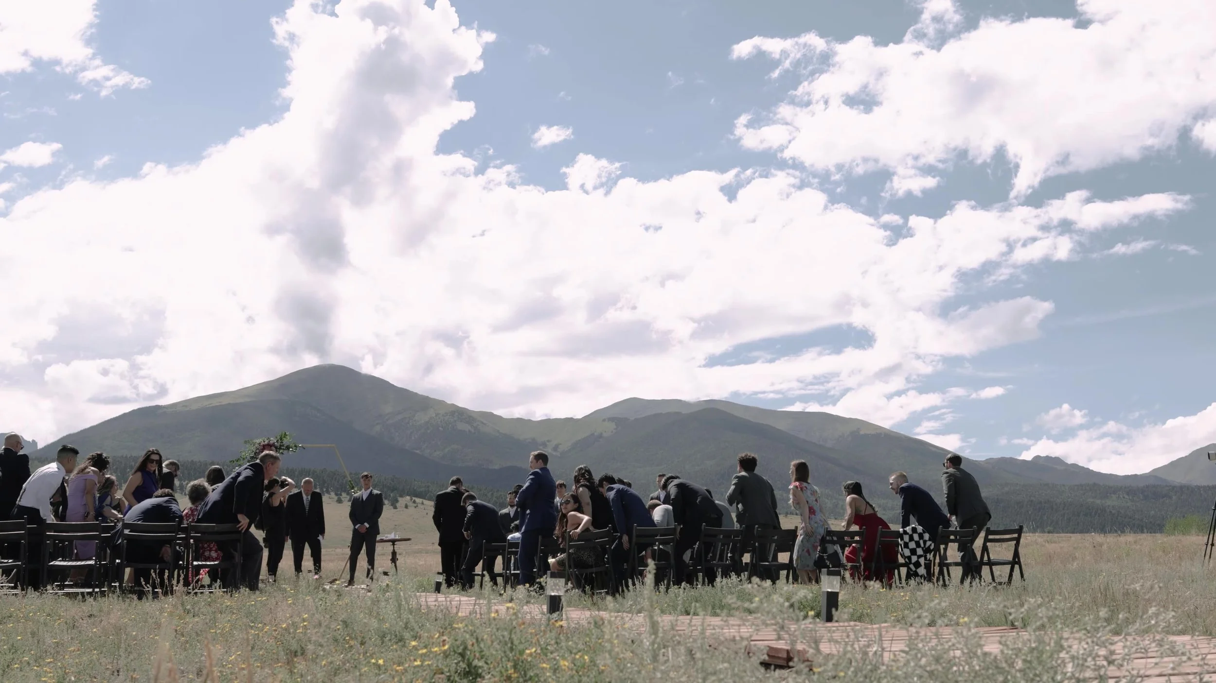 Wide ceremony site with hexagonal arch and mountains at 3 Peaks Ranch in Westcliffe, Colorado