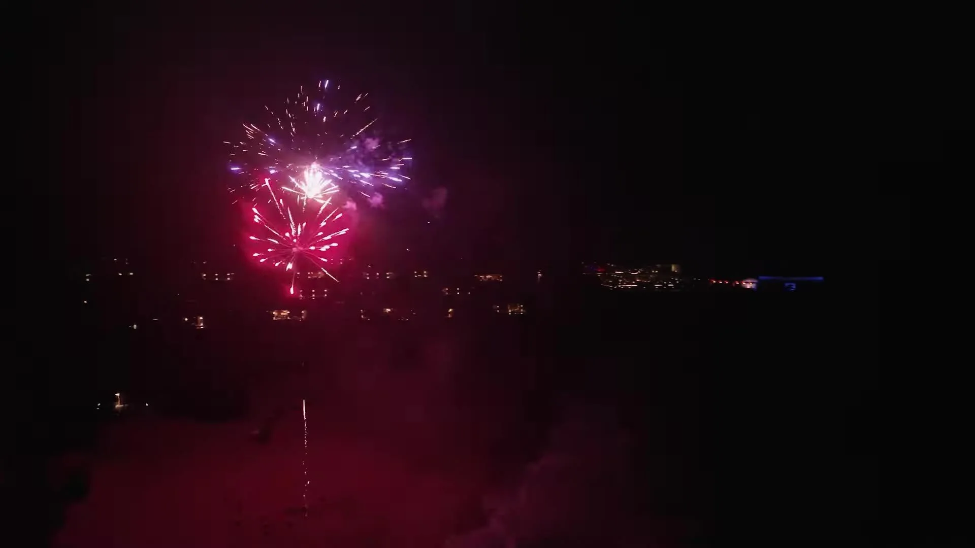 Pink and purple fireworks bursting over Amanera in the Dominican Republic