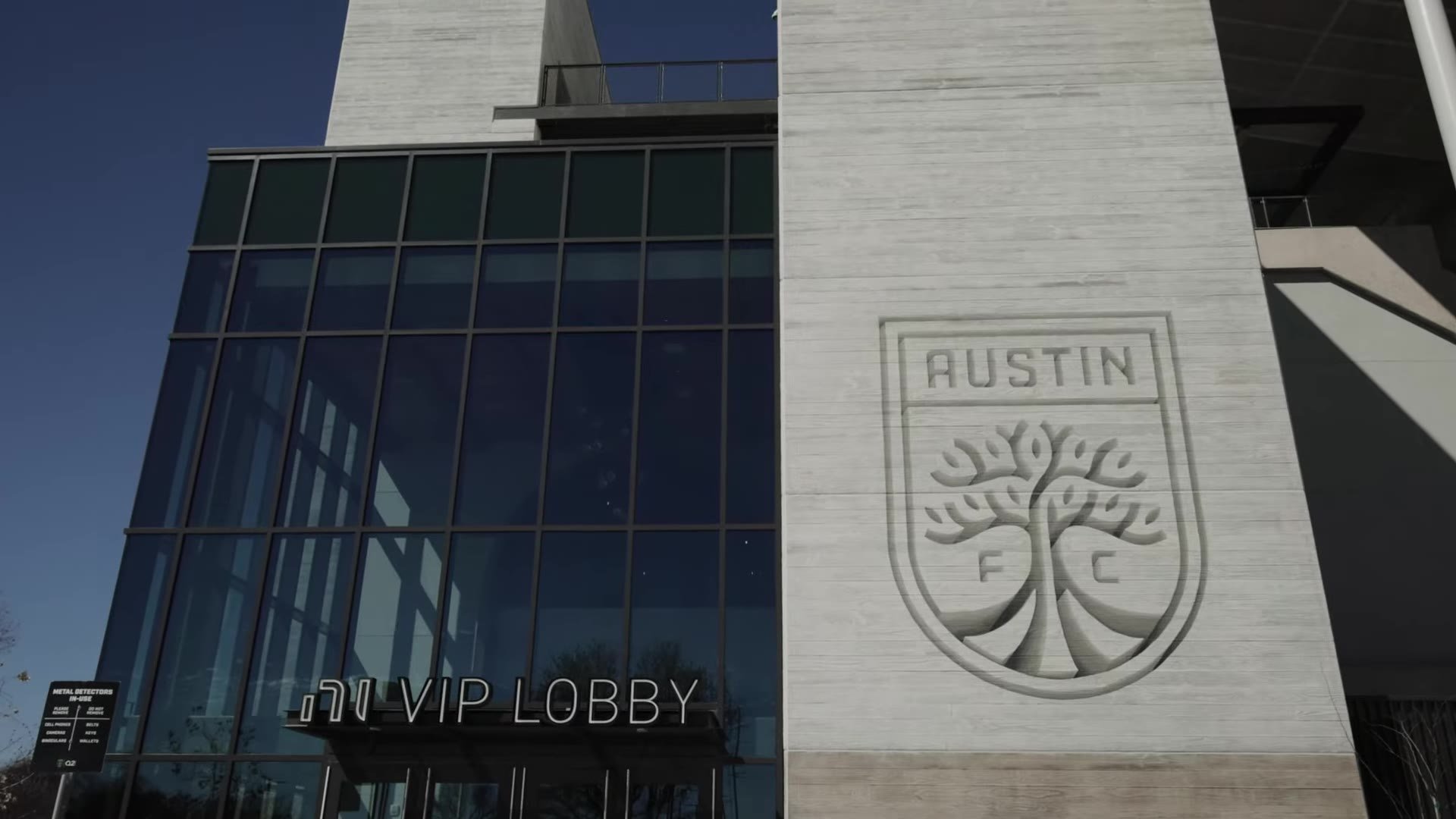 Exterior VIP Lobby entrance with Austin FC crest at Q2 Stadium in Austin, Texas